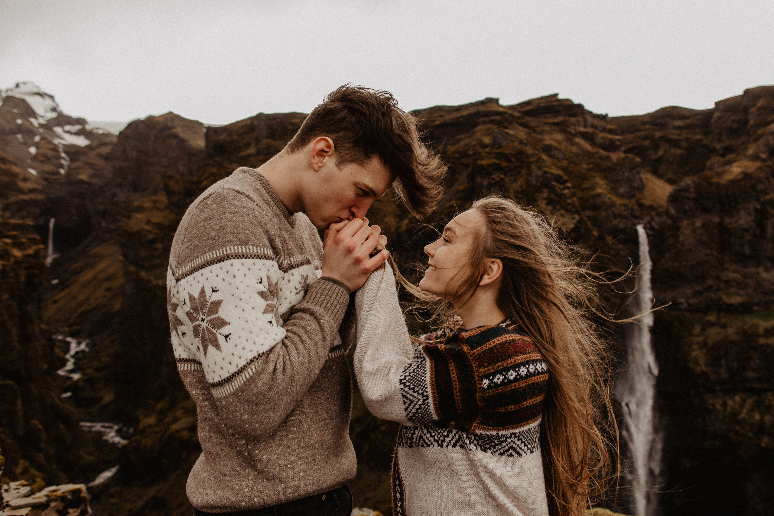 Couple photoshoot in front of volcano eruption in Iceland. Iceland elopement photographer & videographer