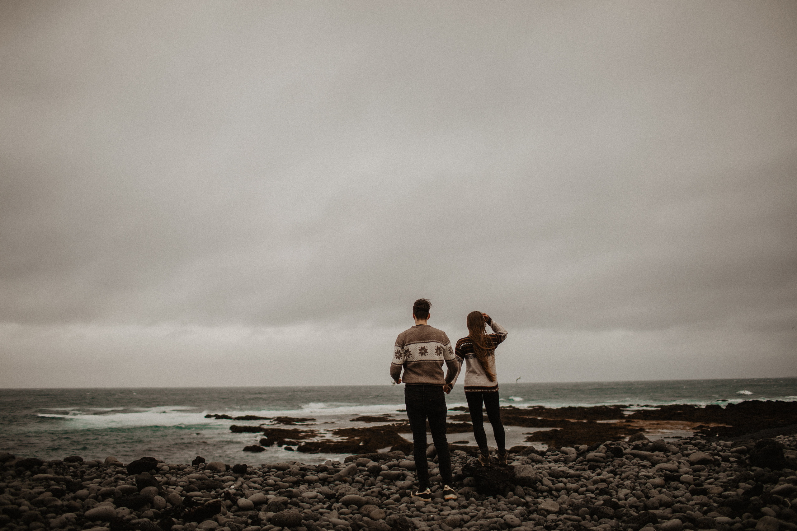 Couple photoshoot in front of volcano eruption in Iceland. Iceland elopement photographer & videographer