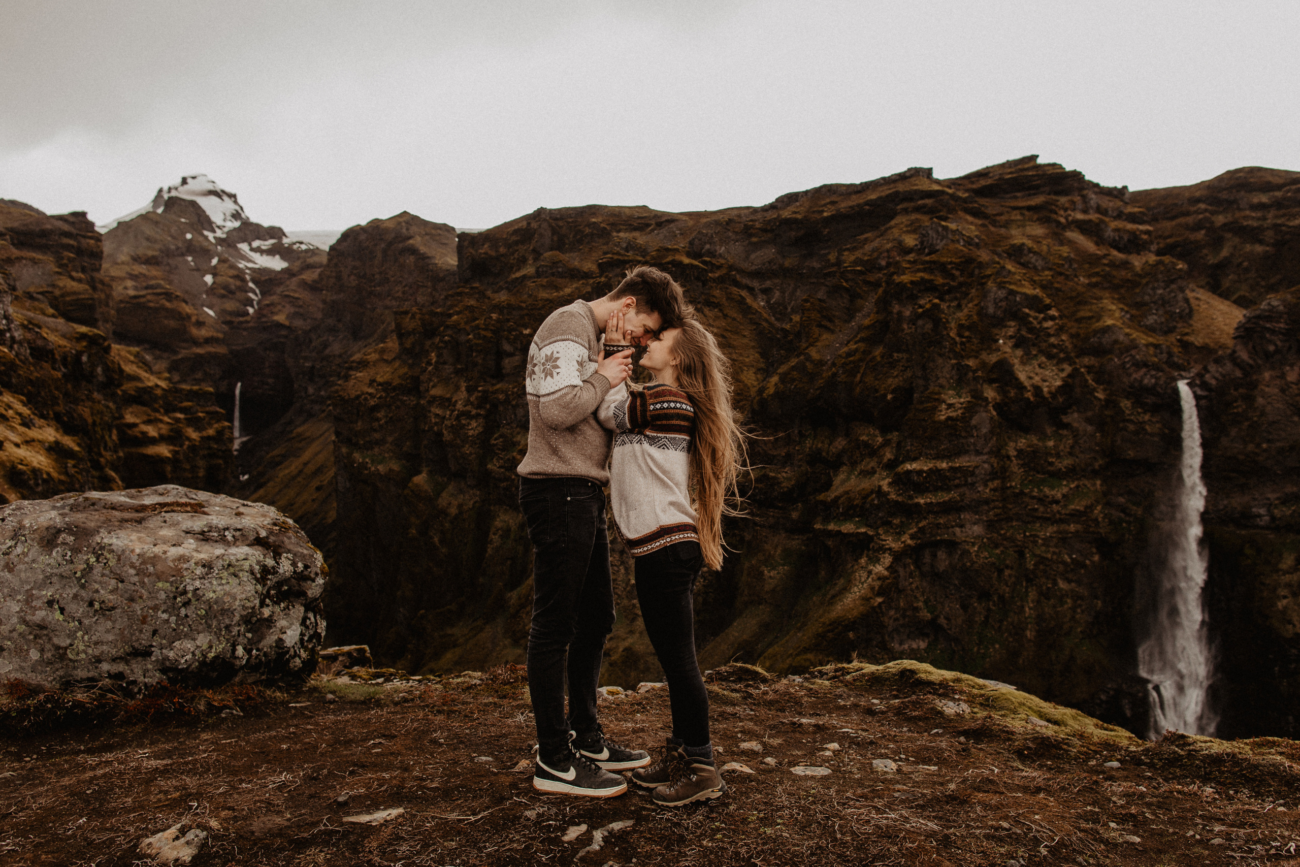 Couple photoshoot in front of volcano eruption in Iceland. Iceland elopement photographer & videographer