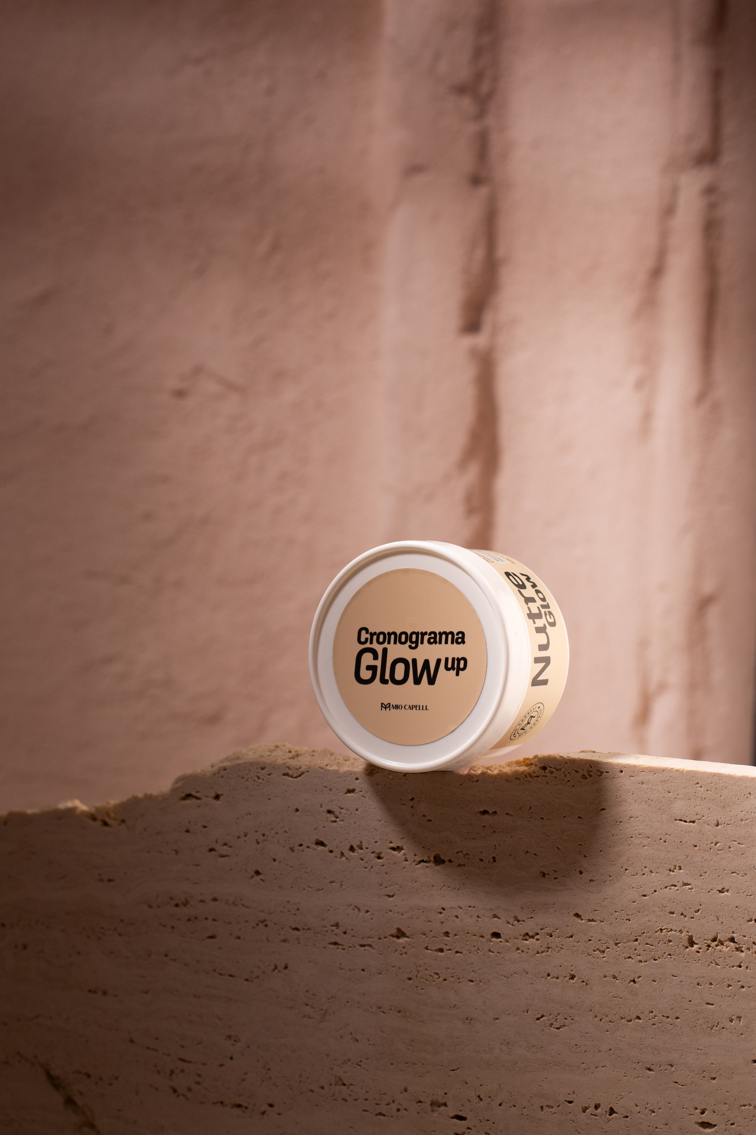 Capturing details of a packaging. smooth light, stone backdrop. 