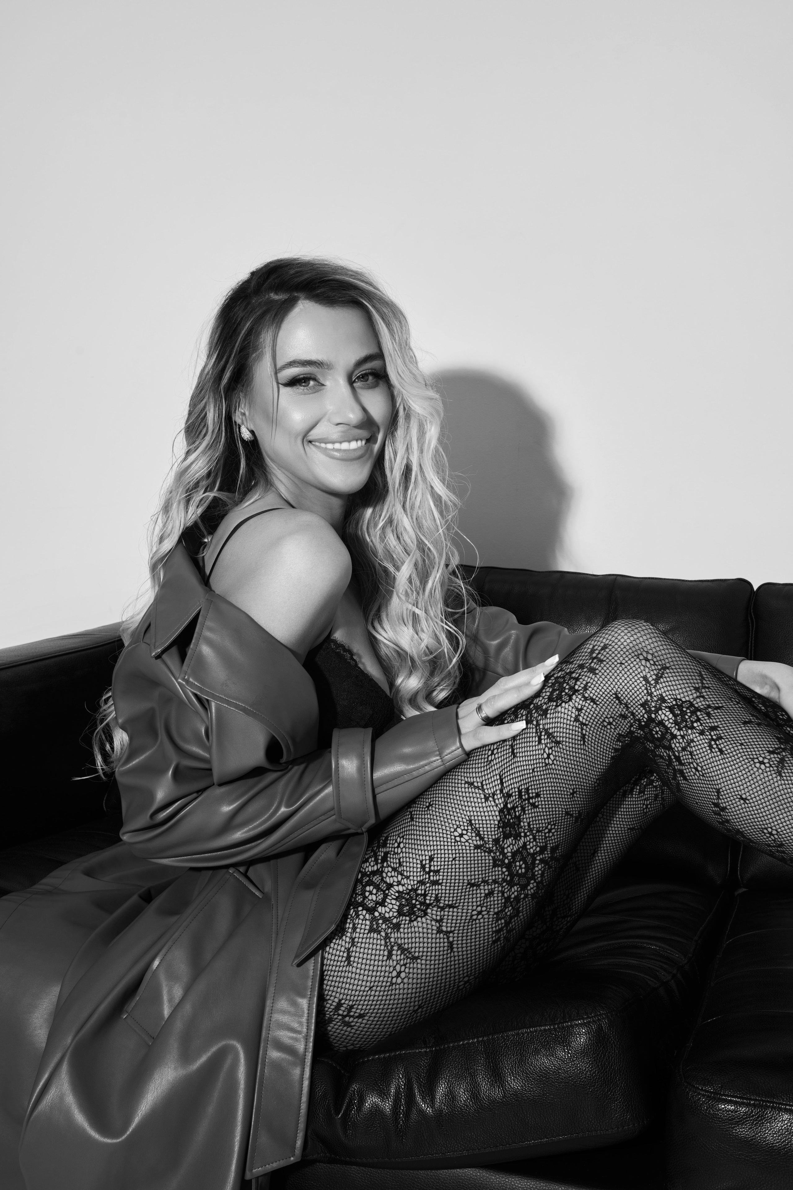 Stylish minimalist studio photo of woman in couture dress with daylight Warsaw