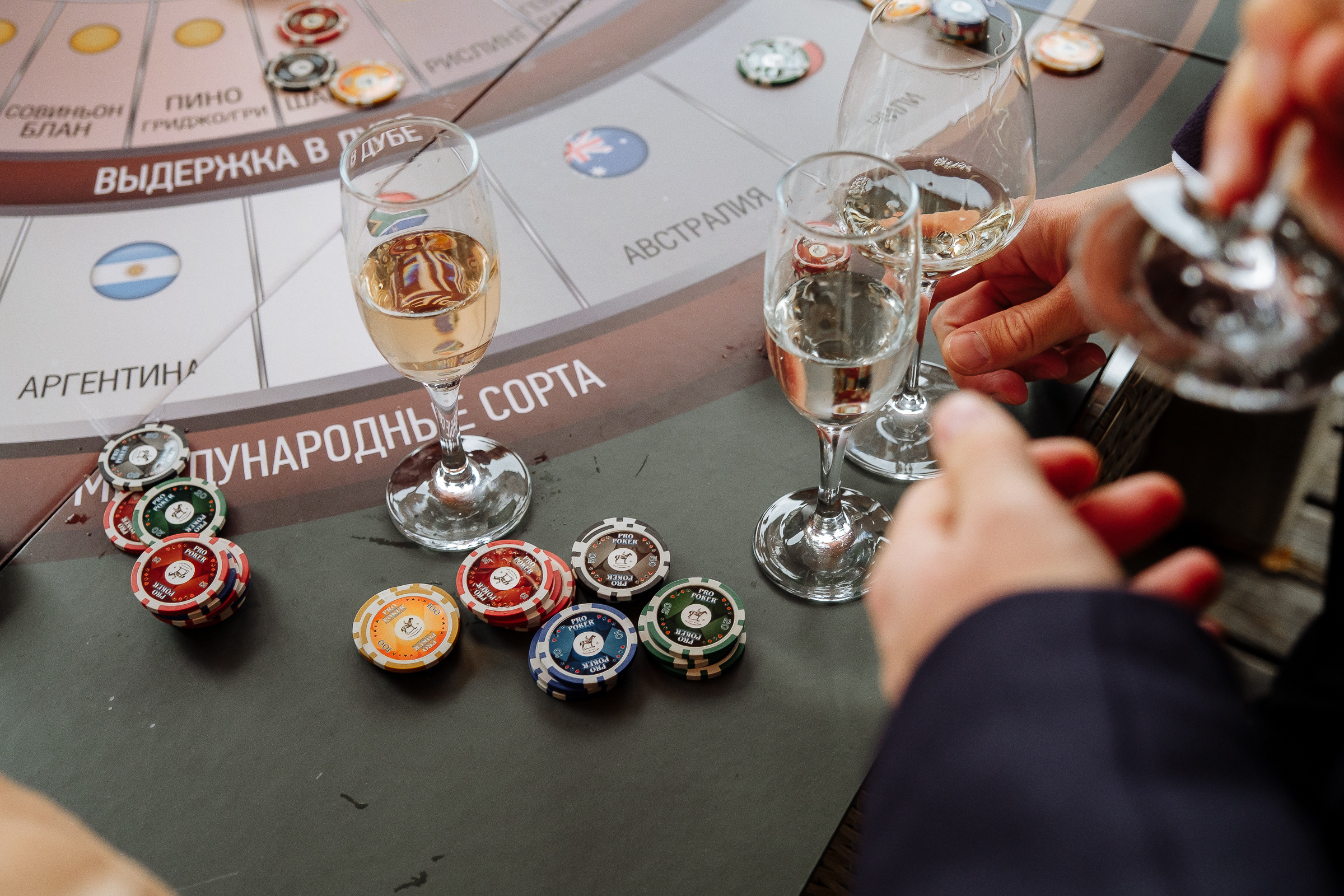 Guests gambling on riverboat, by Tanya Bodgan, Bude wedding photography.  