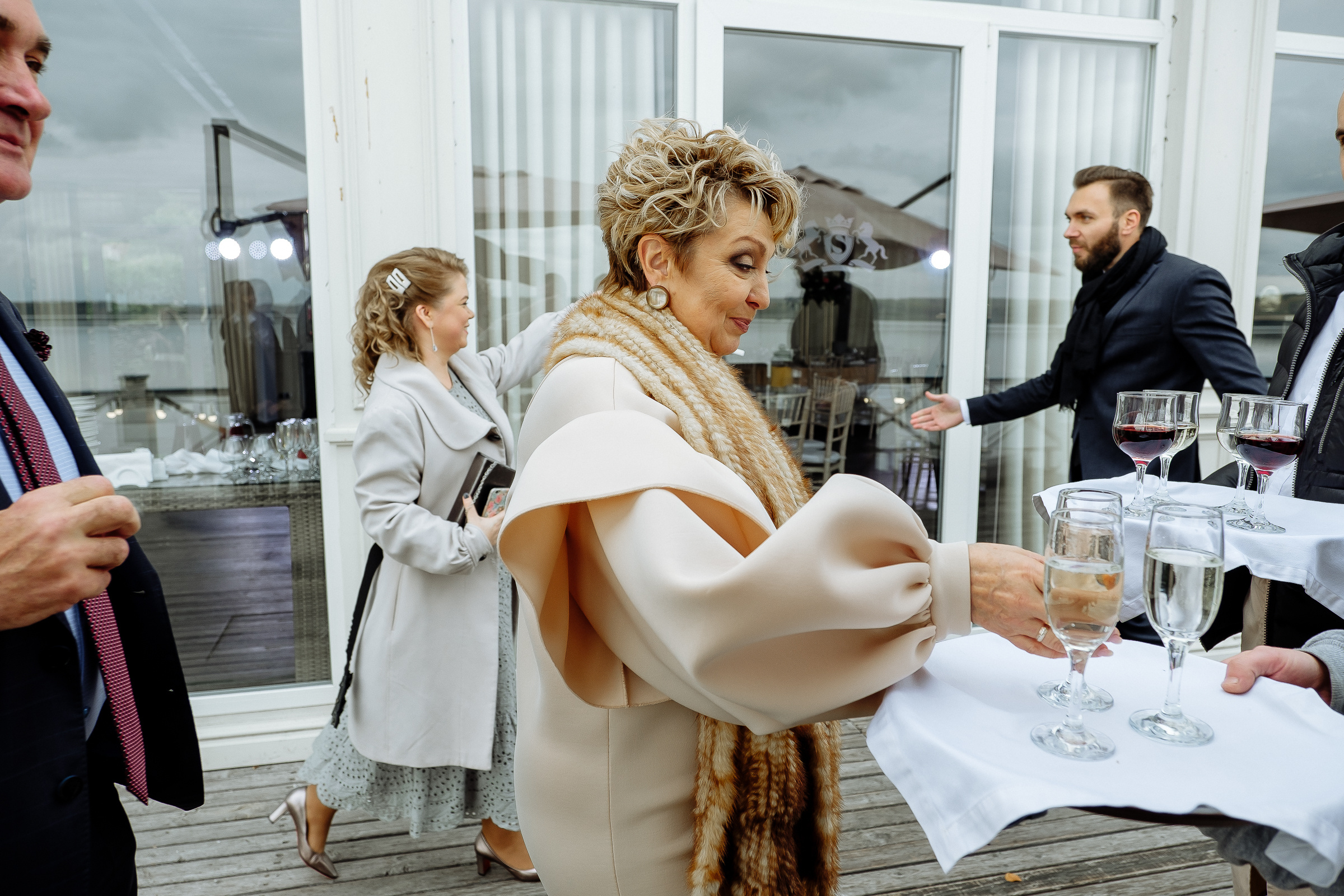 Guests on riverboat with river views, by Tanya Bodgan, Bude, Cornwall wedding photography.  