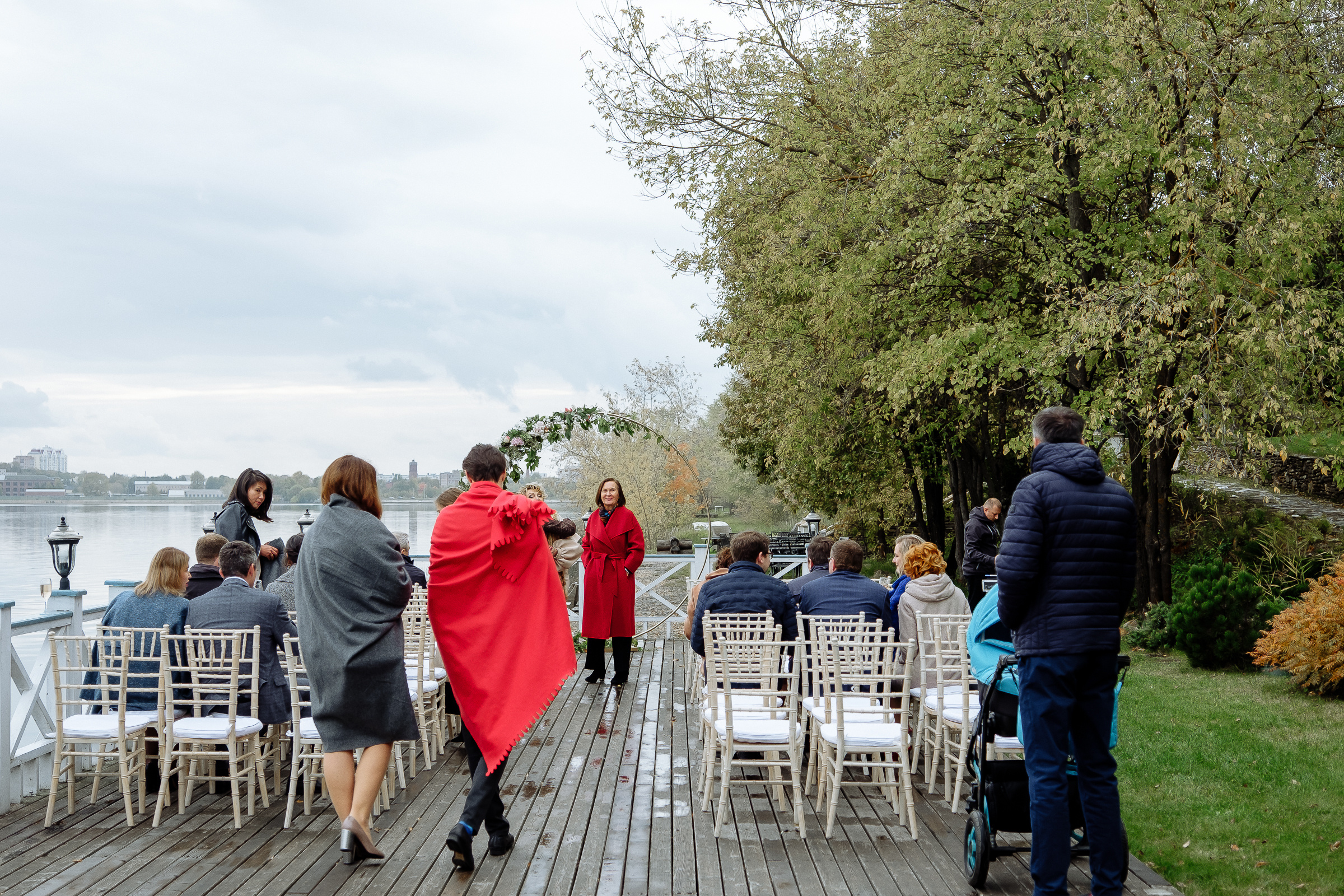 Guests on riverboat deck, by Tanya Bodgan, Bude, Cornwall wedding photographer.  