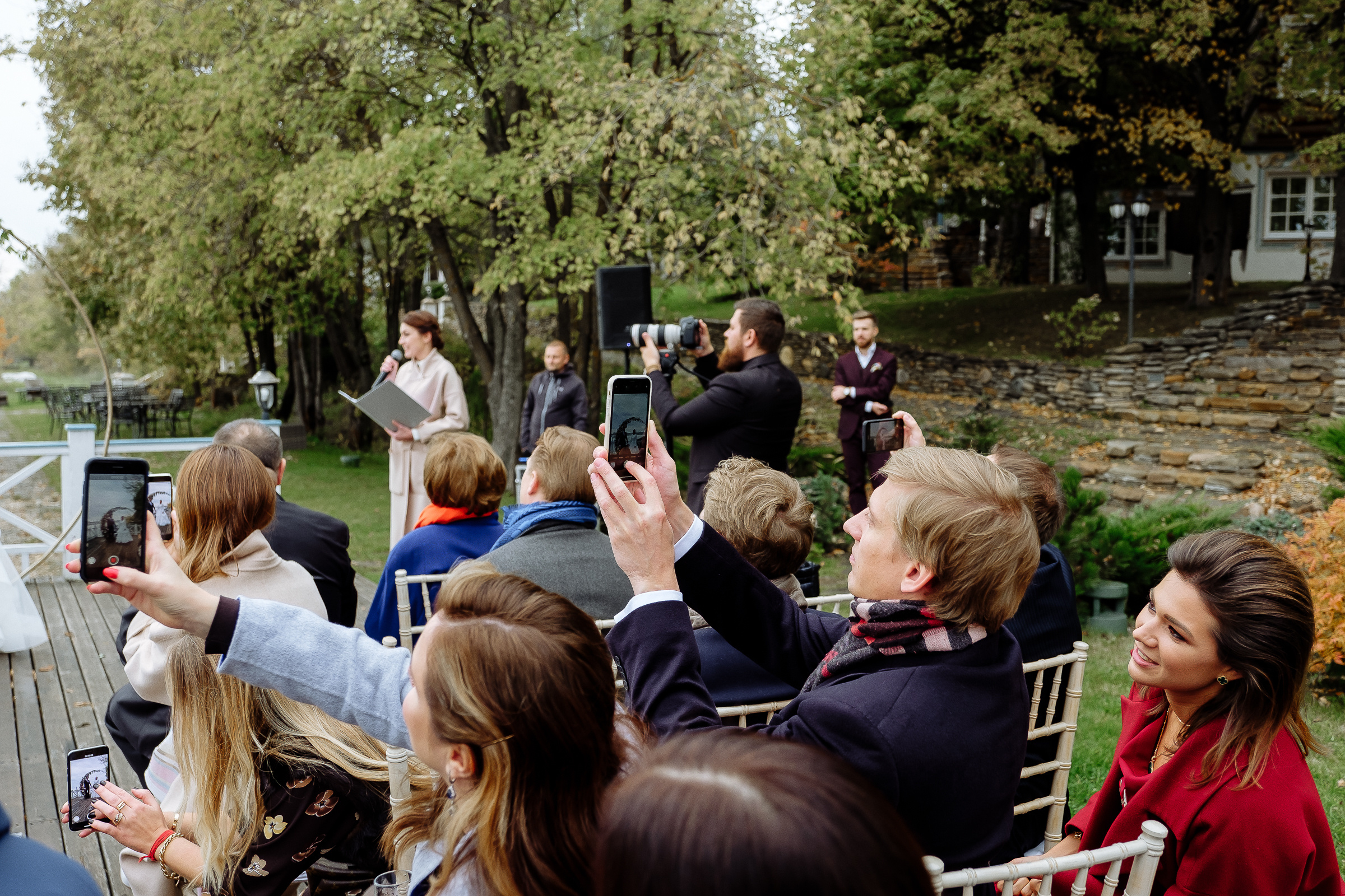 Guests clapping by riverside, by Tanya Bodgan, Bude wedding photographer.