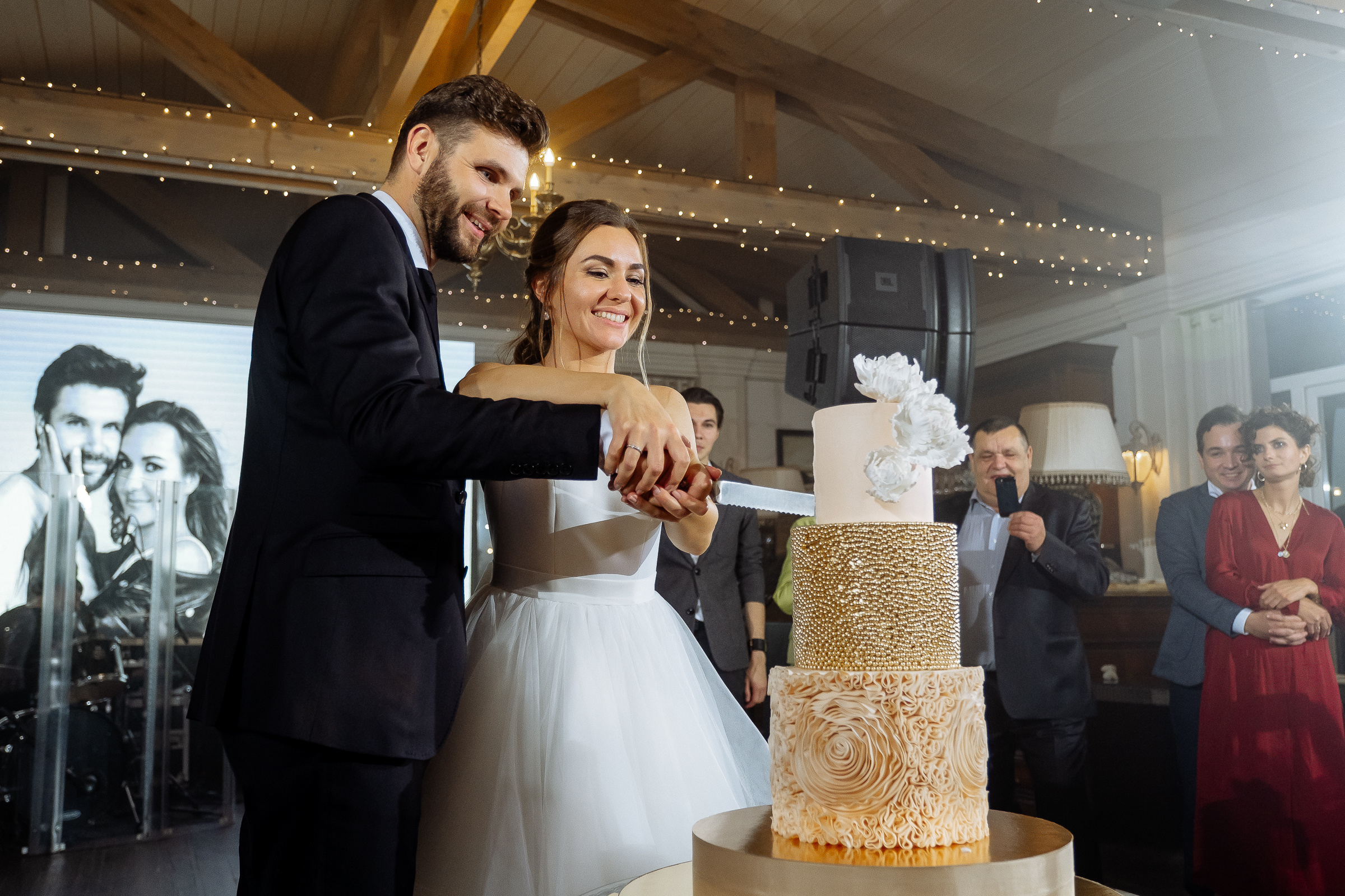 Wedding cake cut, by Tanya Bodgan, Cornwall wedding photography.