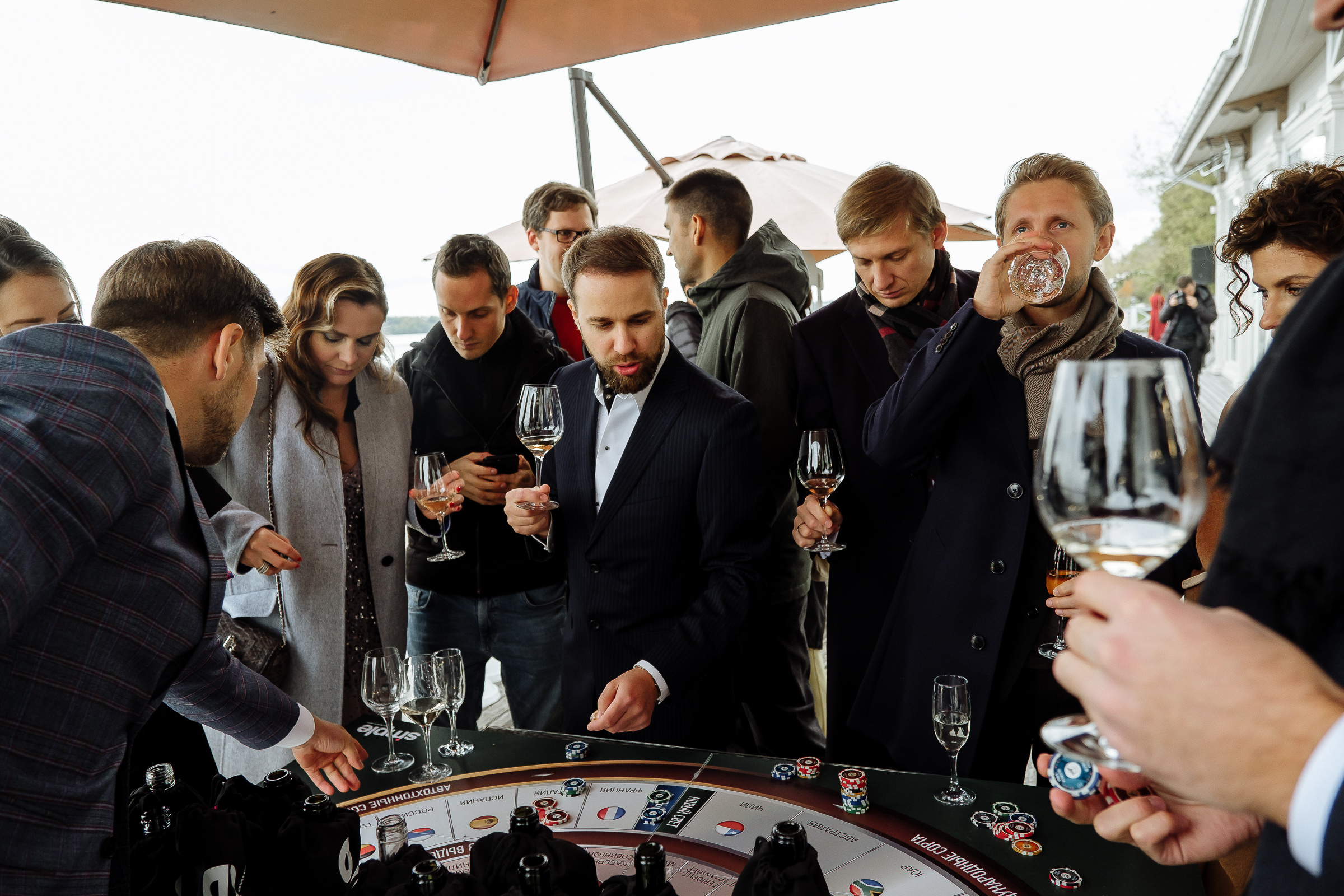Guests at roulette table, by Tanya Bodgan, Bude, Cornwall wedding photographer.  