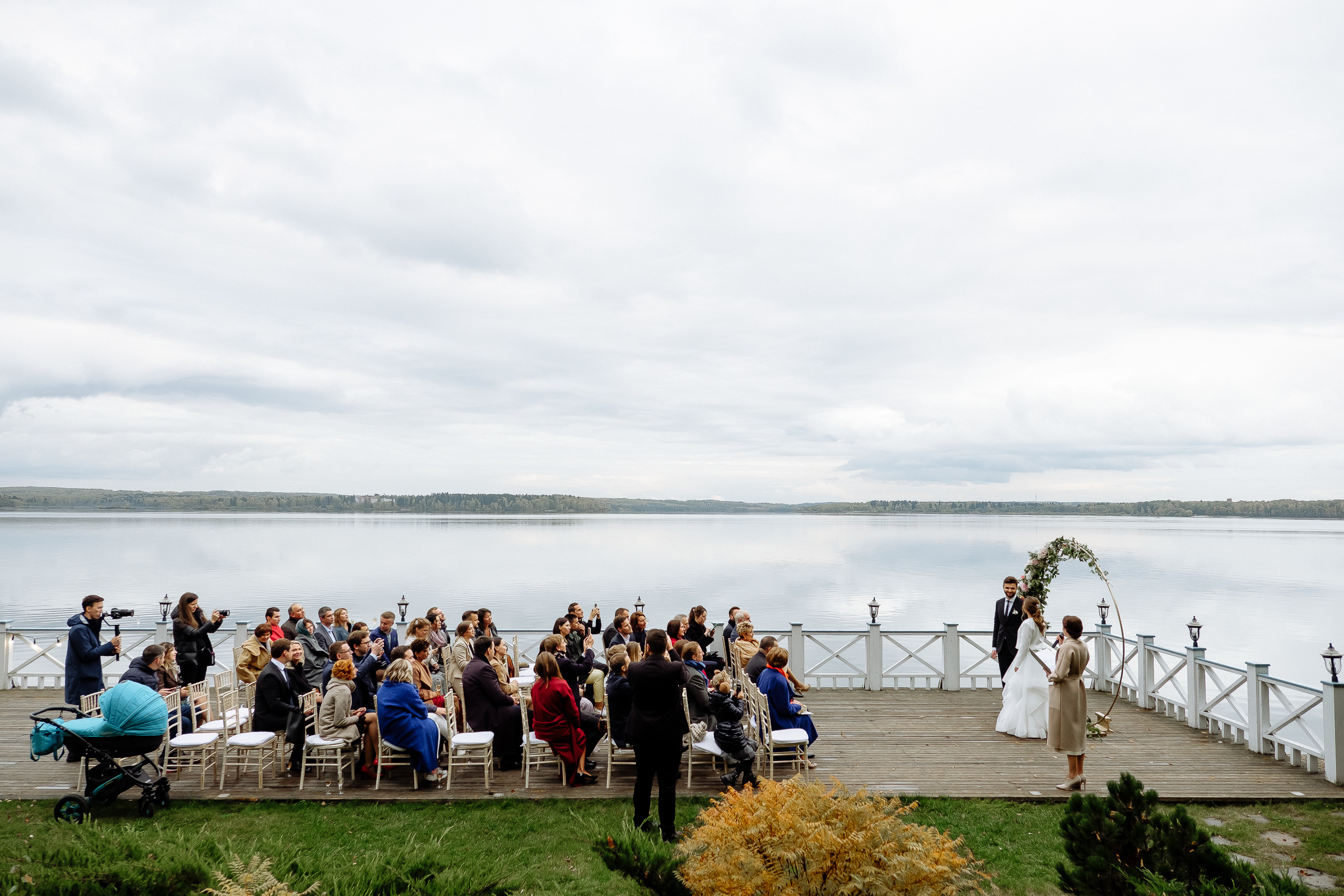 Ceremony by river, by Tanya Bodgan, Bude wedding photography.