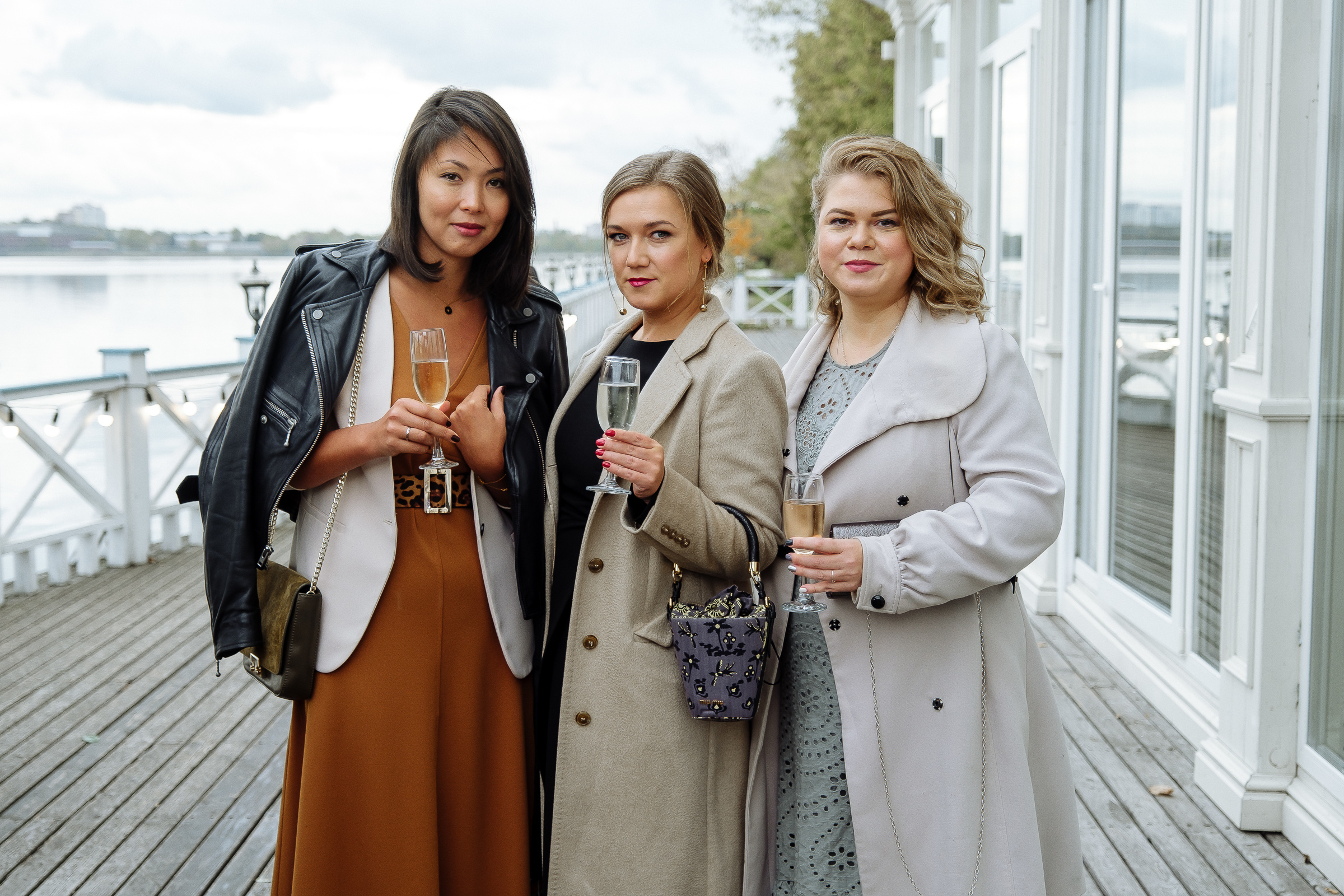Guests on riverboat with river backdrop, by Tanya Bodgan, Bude wedding photography.  