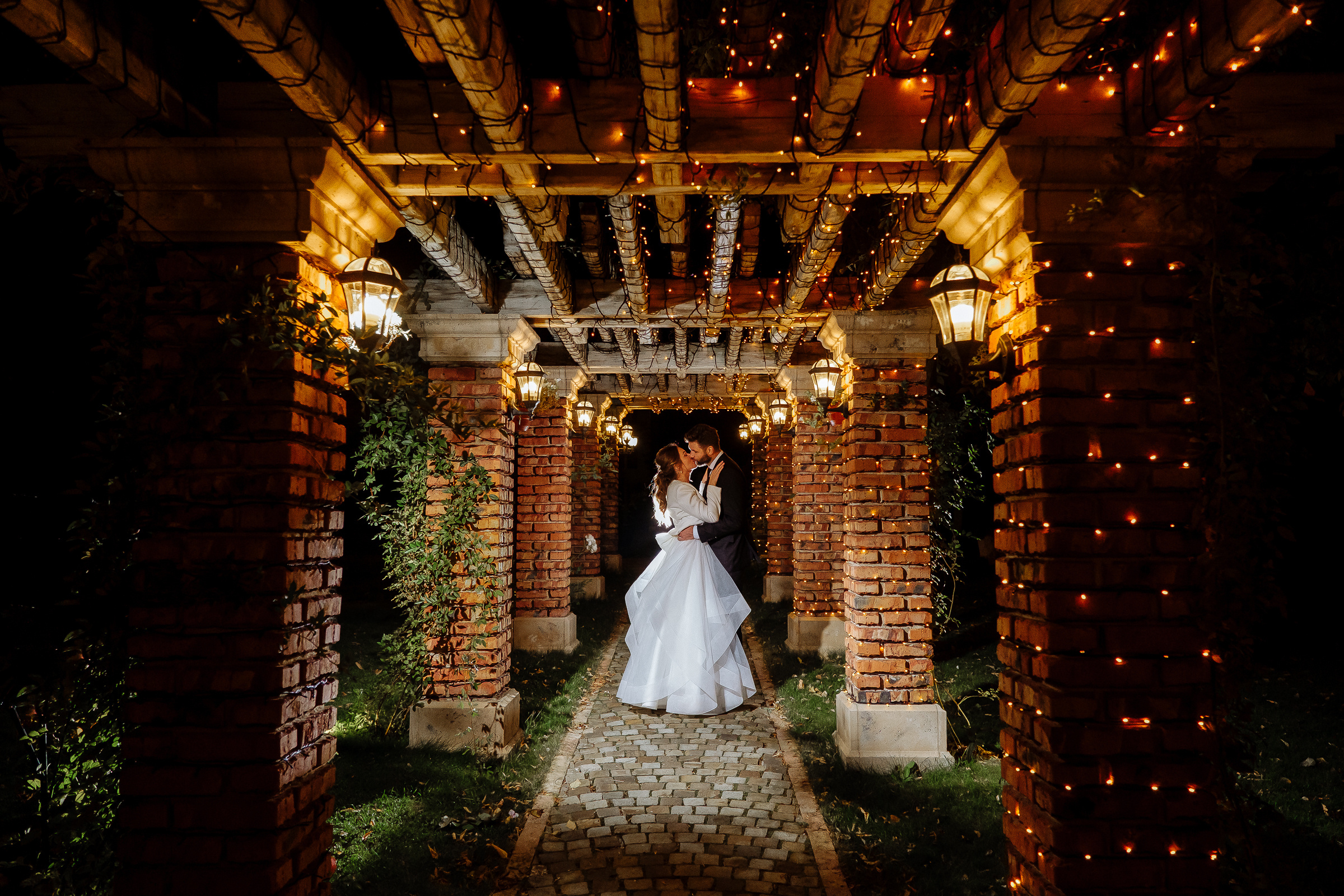 Bride and groom kiss outdoor, by Tanya Bodgan, Bude, Cornwall wedding photographer.