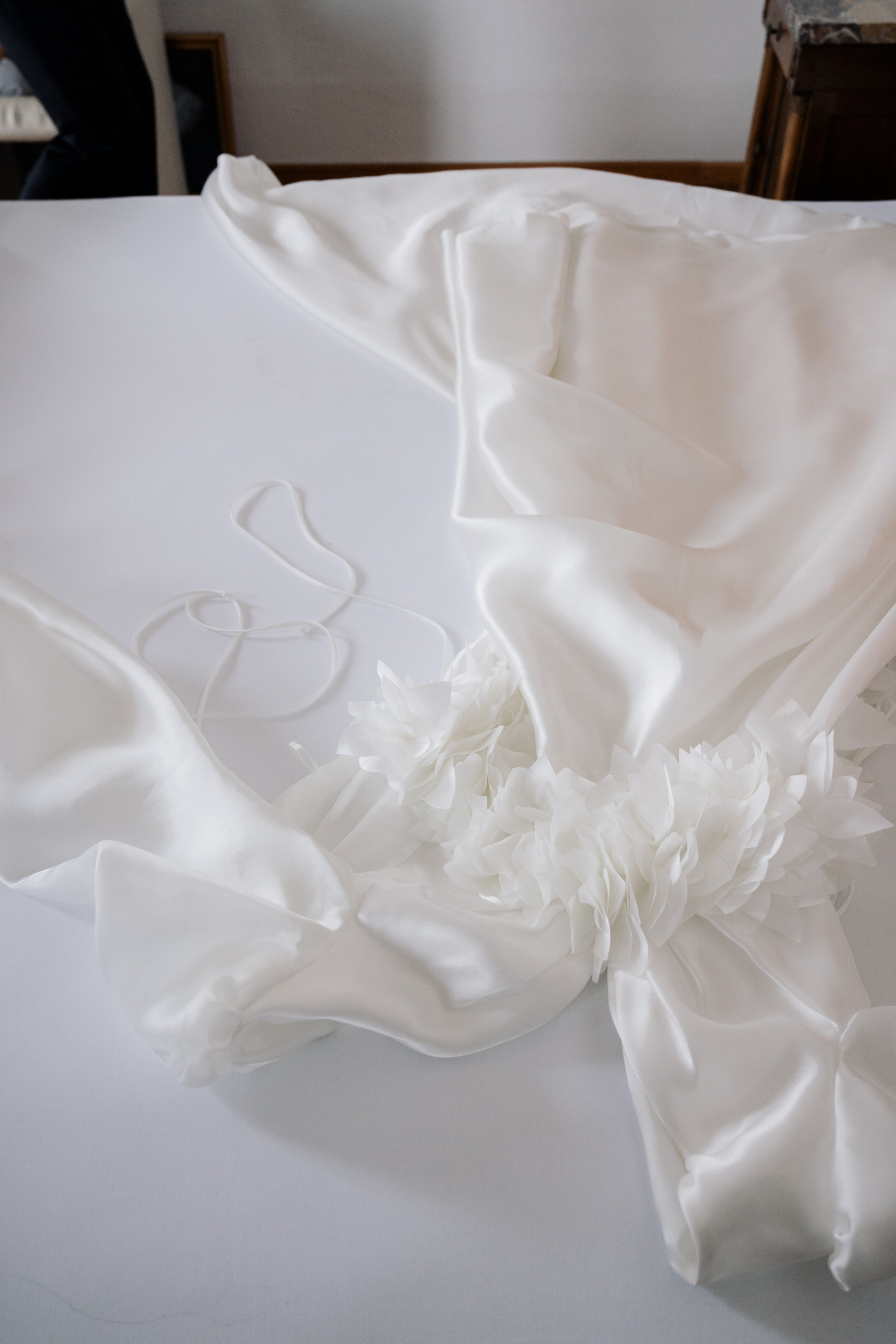 a white cloth with a flower on it