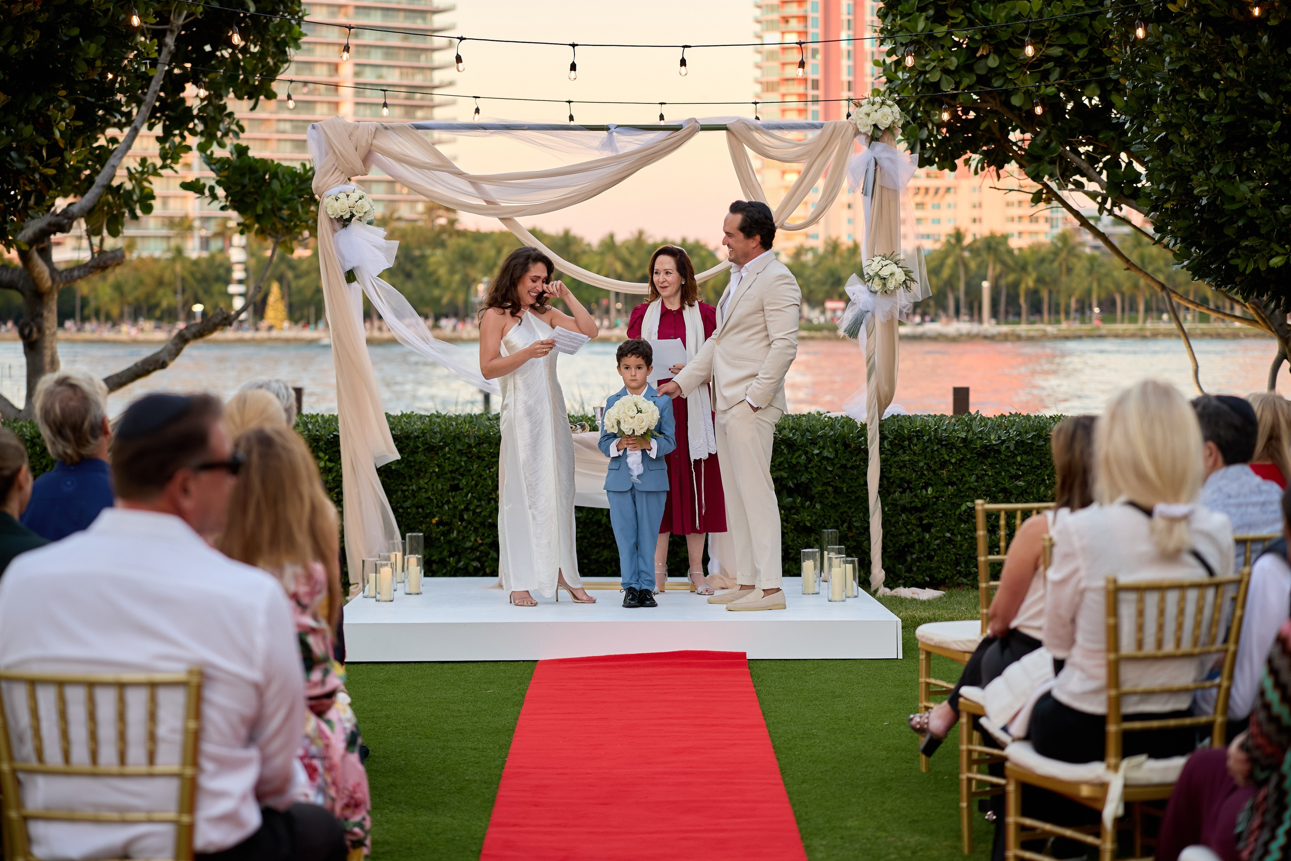 Bride and groom standing at their waterfront wedding ceremony