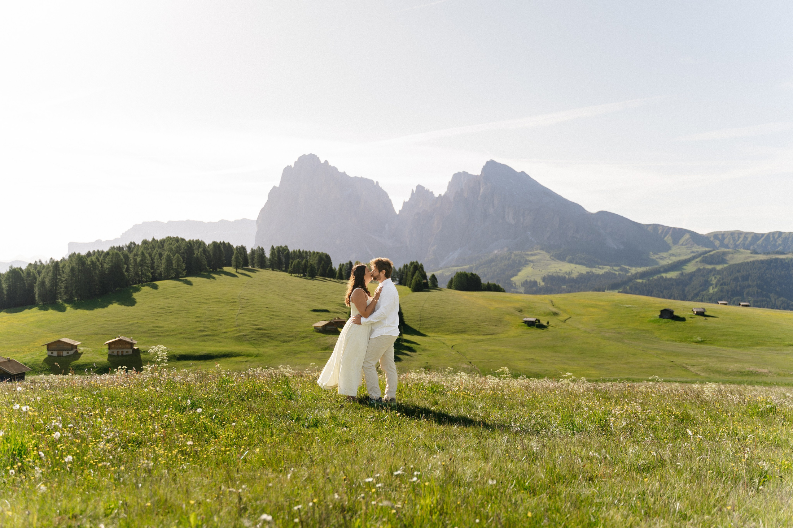 Couple celebrating their engagement at Alpe di Siusi, Italy.
