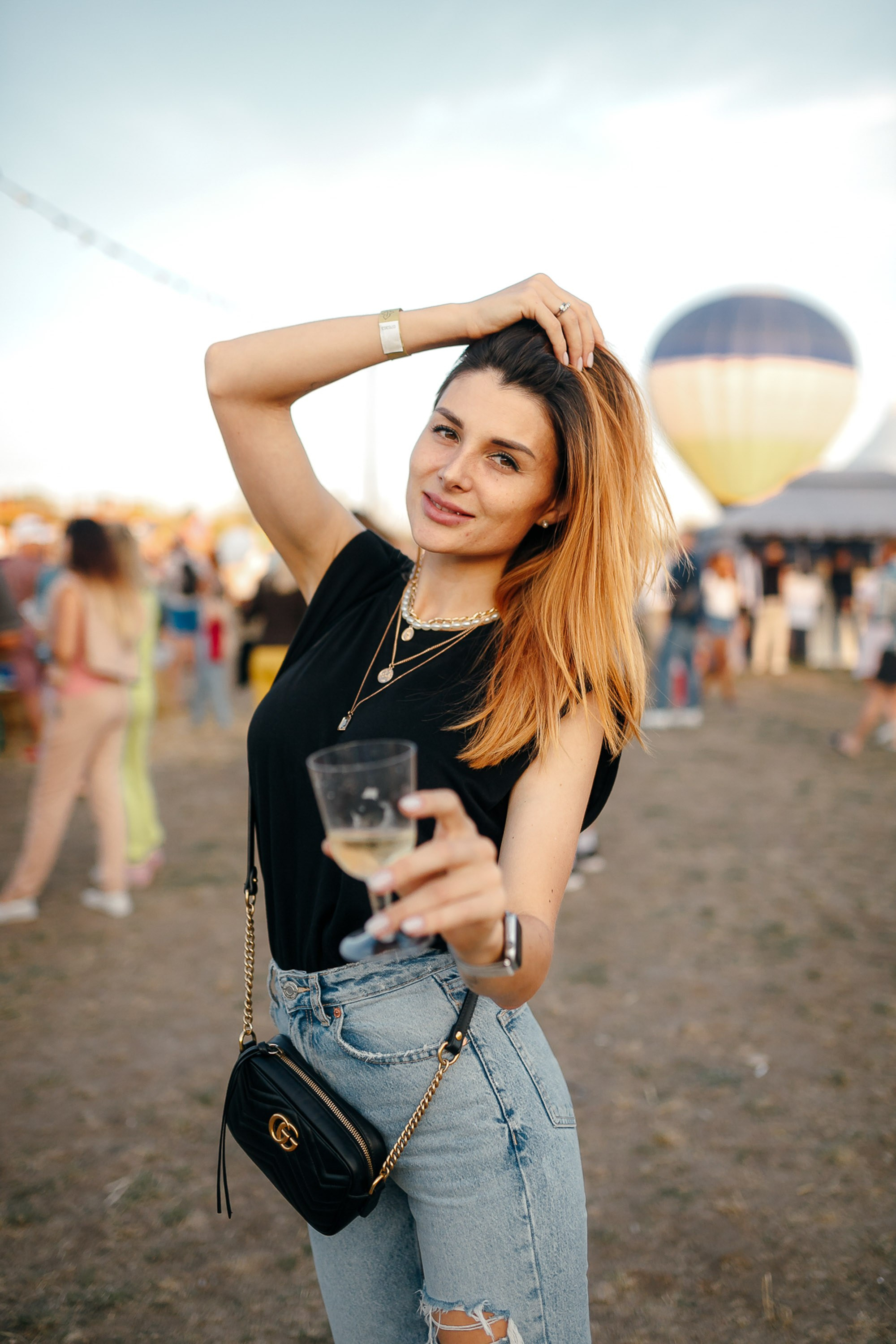 Young woman in sunglasses at outdoor event