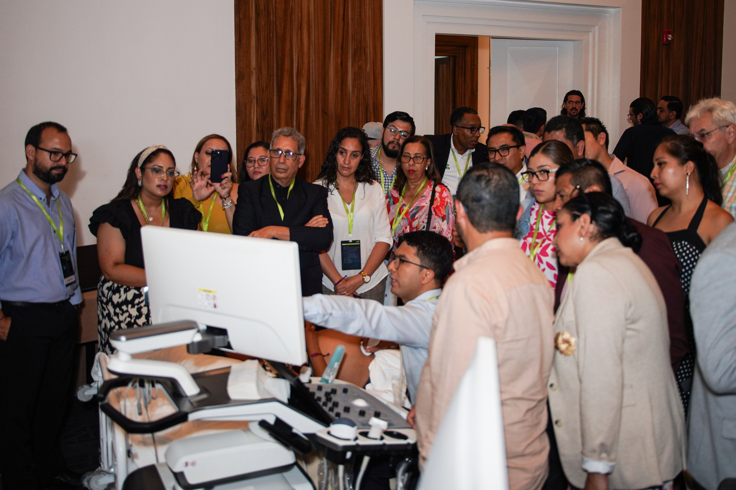 Medical expert demonstrating new diagnostic device during corporate presentation.