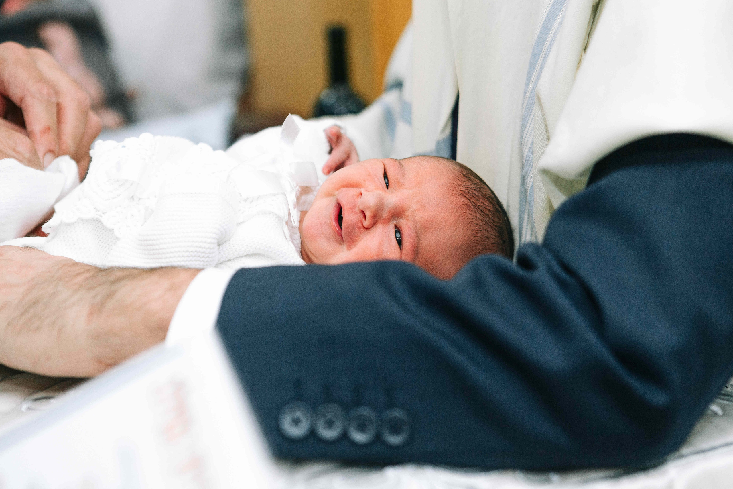 BRITH MILA IN THE SMALL SYNAGOGUE. PHOTOGRAPHER IN ISRAEL