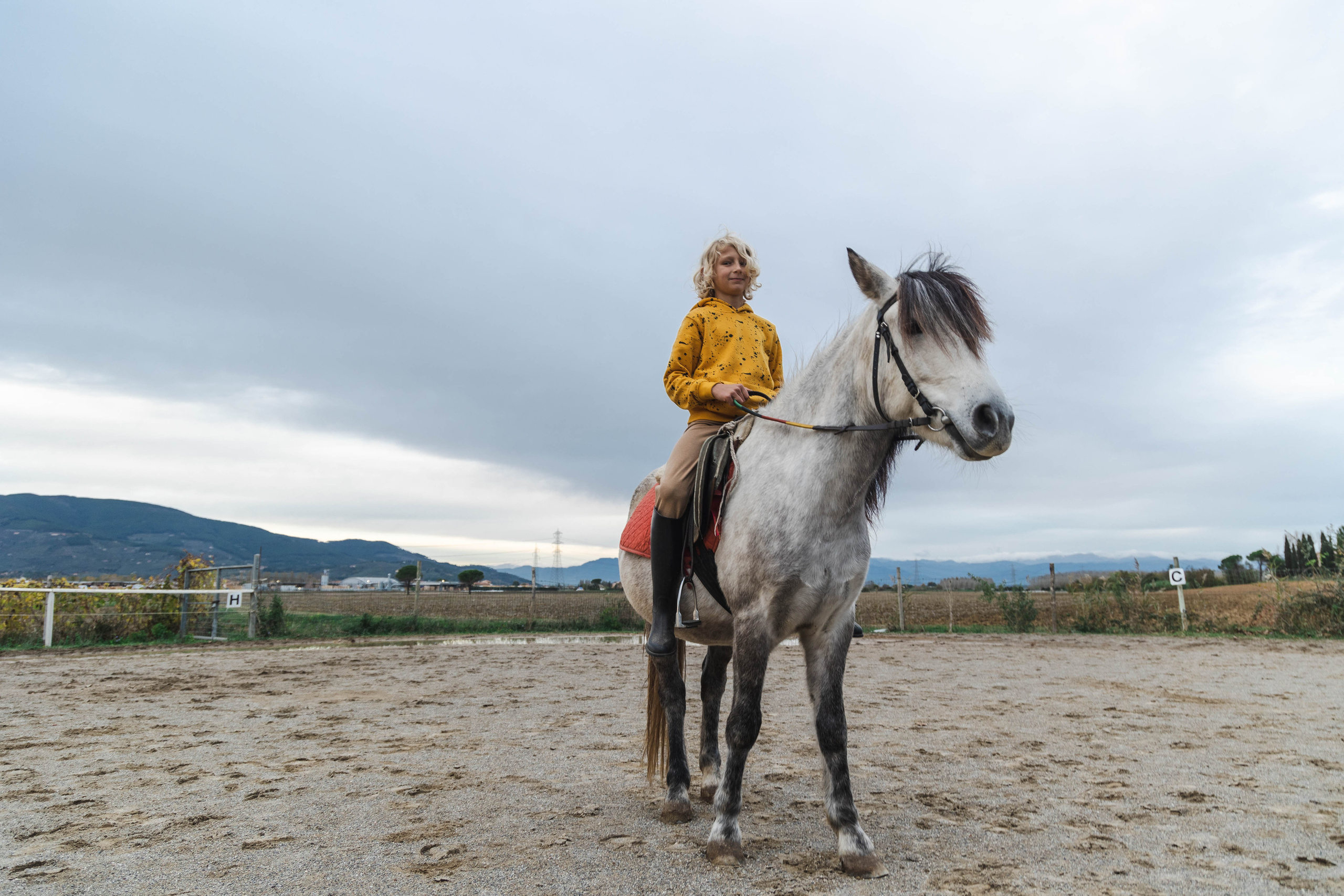Filip and horses in Italy. Nina Janeckova Photographer and Videographer in Bodensee Ravensburg