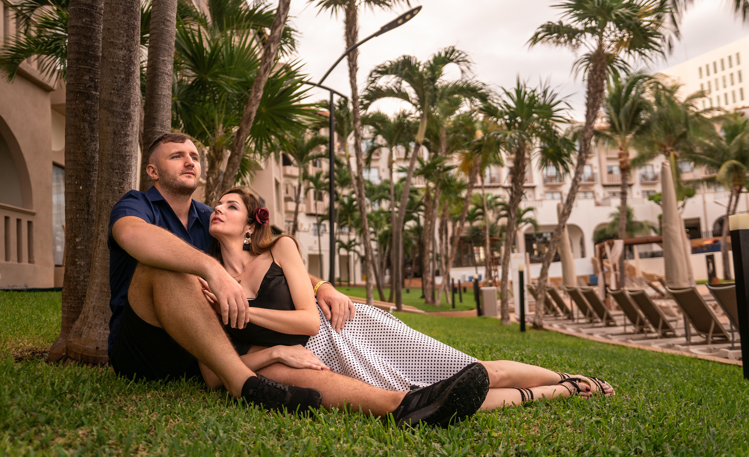 Stylish duo enjoying their romantic getaway at a tropical resort in Cancún, Mexico.