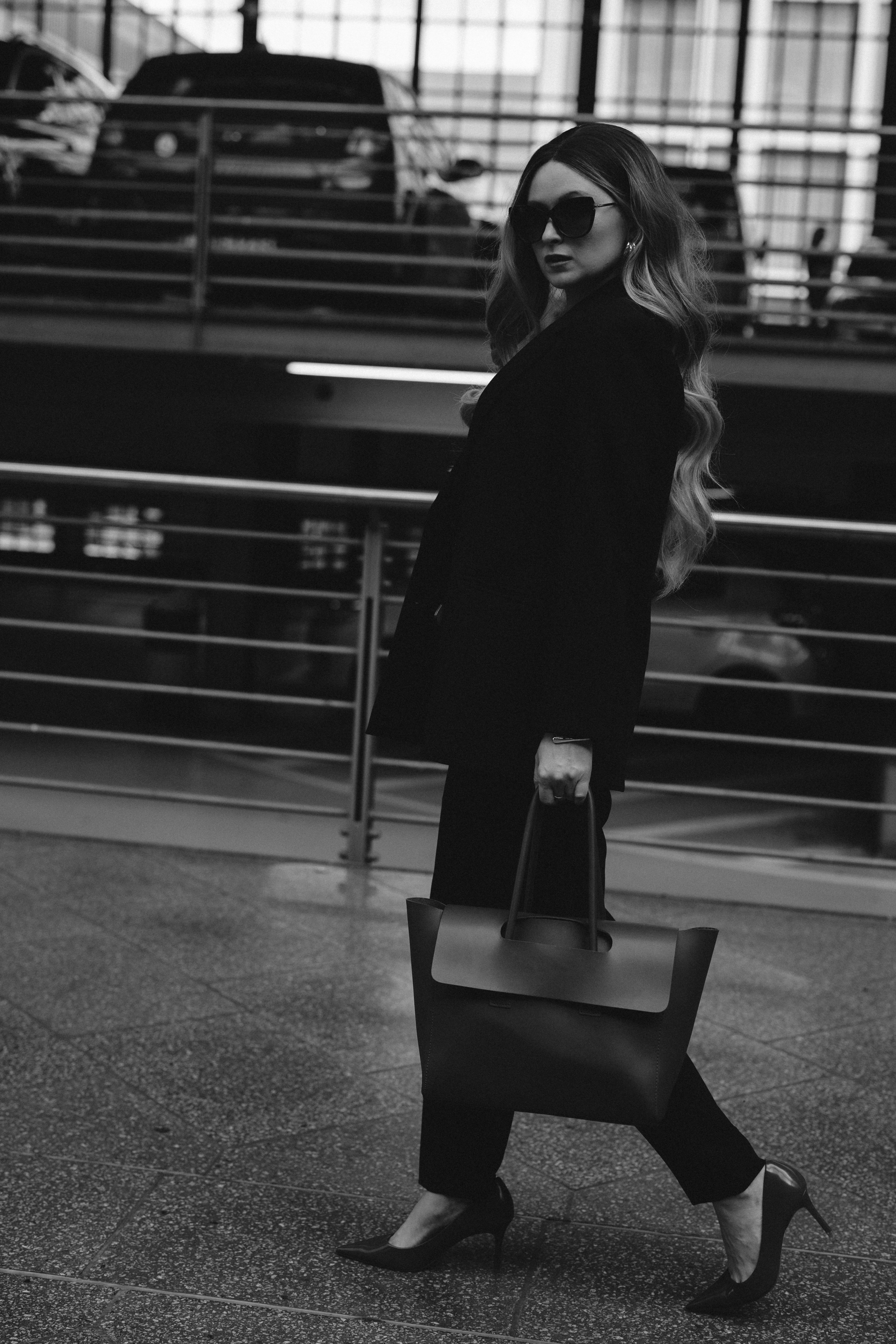 Black&White city walk. Woman in Heels&Black suit. Cinematic Portrait Photography. Kristina Kozheltsova- Soulful Portrait&Lifestyle&Love Story Photographer in Leipzig, Germany