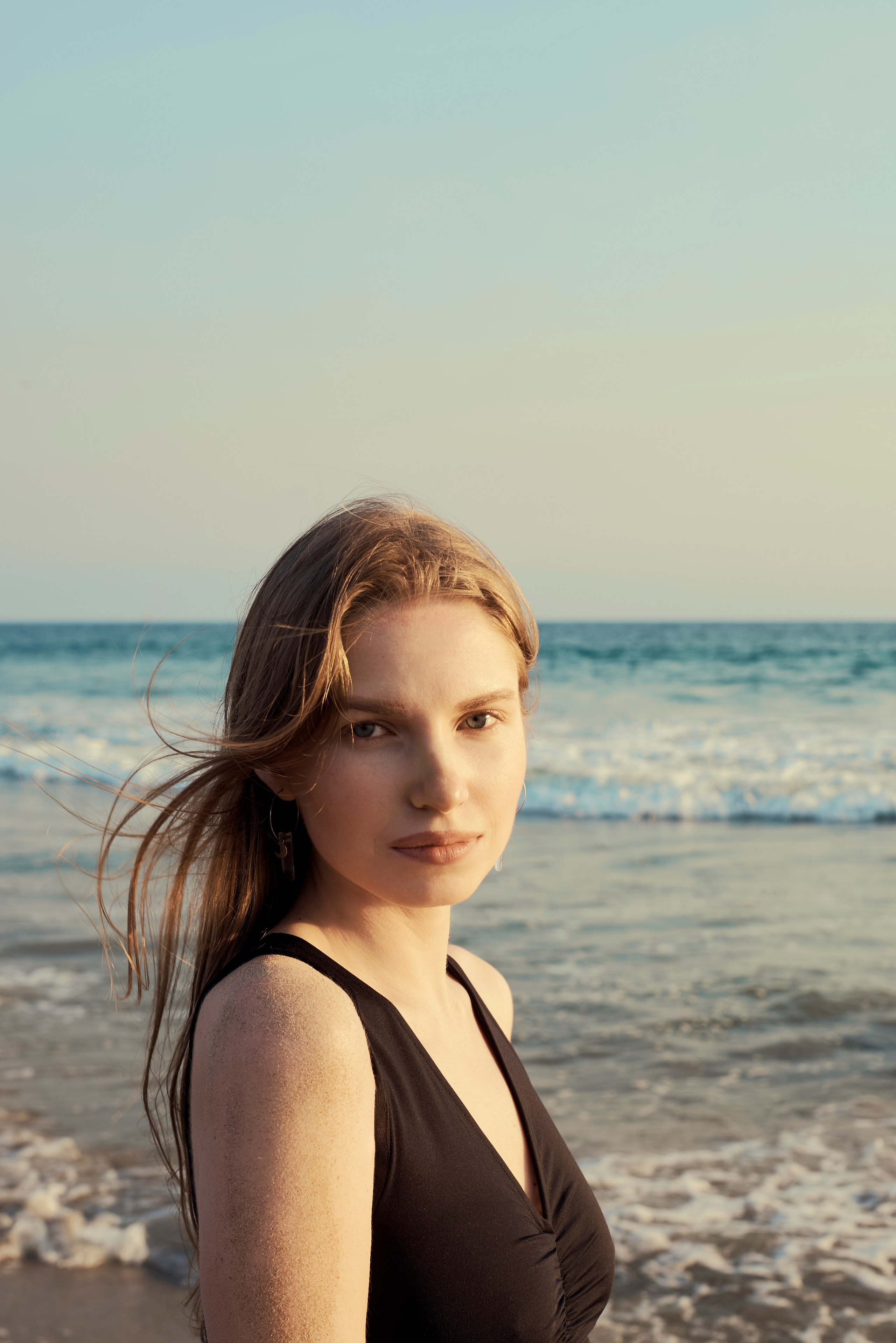 Beautiful girl against the sunset backdrop in Los Angeles