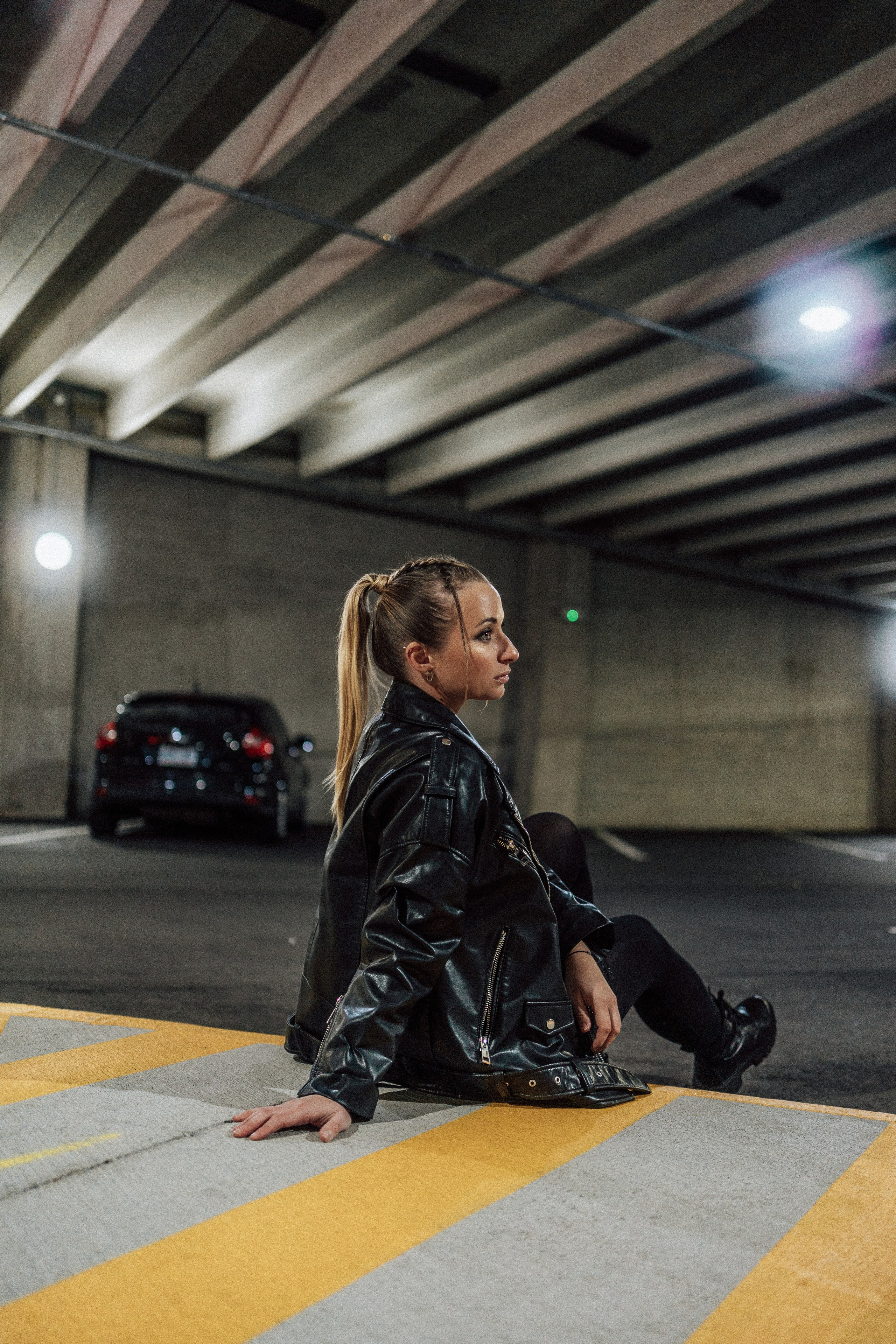 Individual portrait session on a rooftop in Windsor, Ontario, showcasing a creative blend of urban vibes and personal style.