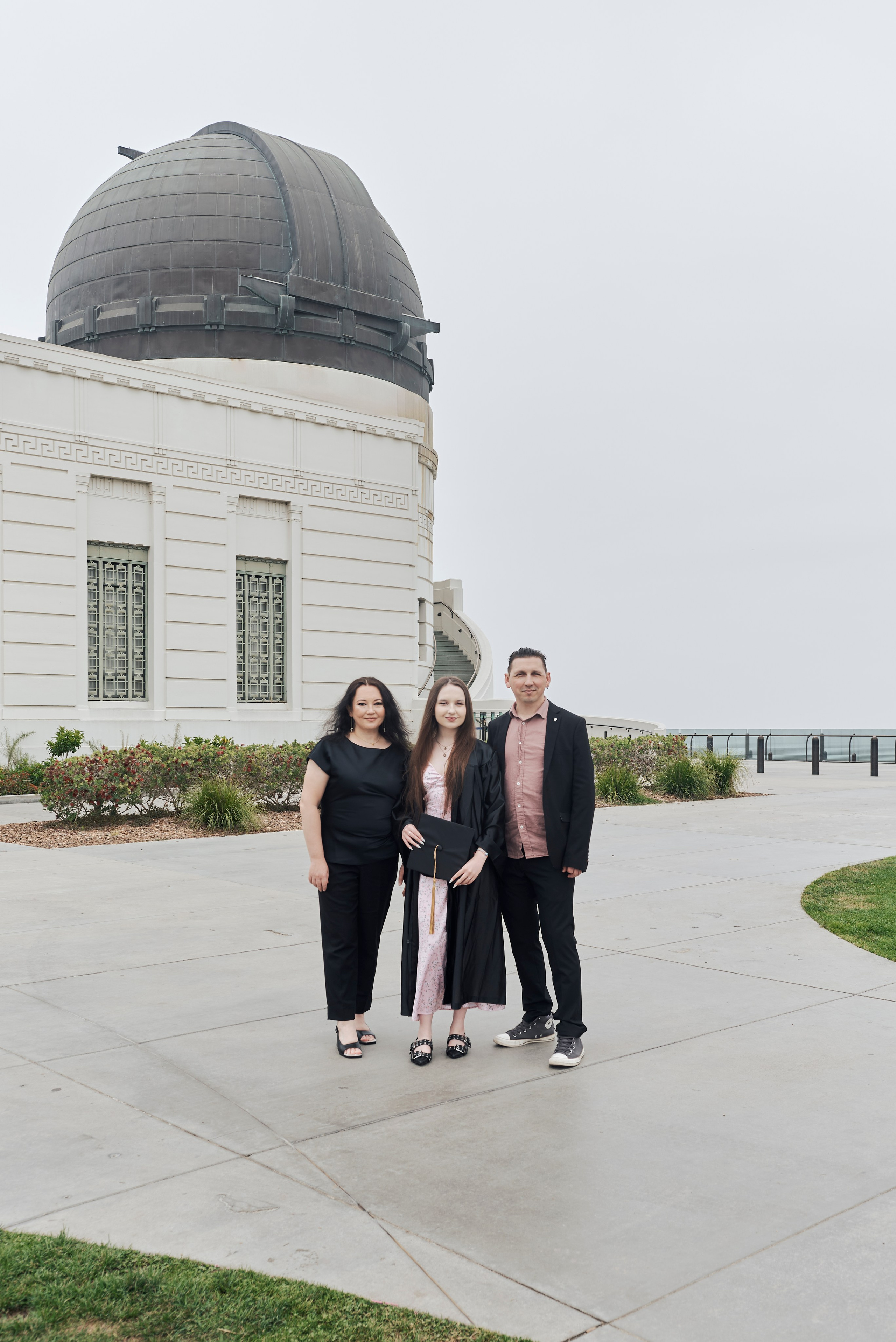 Fun and lively graduation photo of a student with colorful confetti in Los Angeles