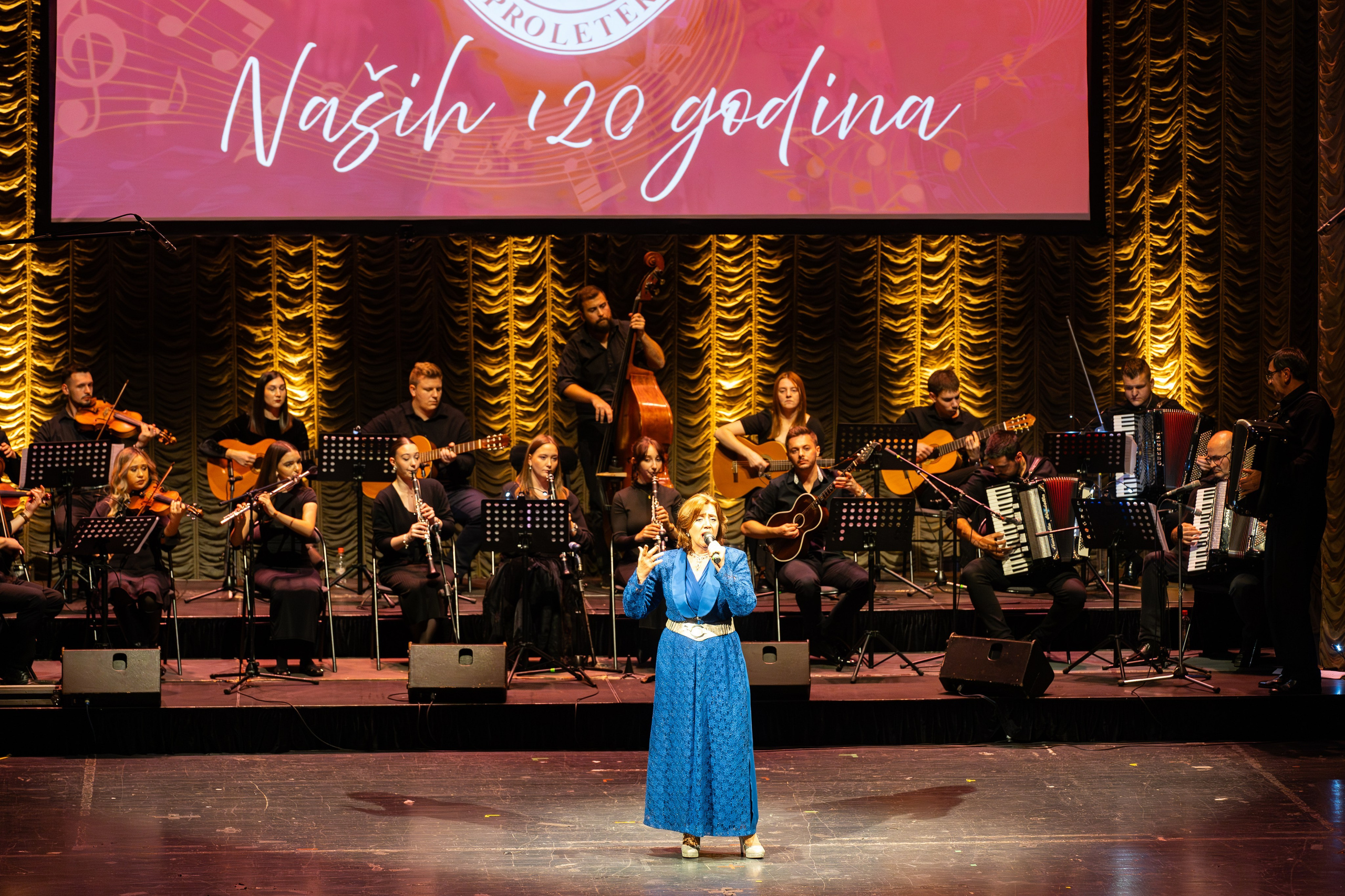 Ceremonial Concert RKUD Proleter is a photography series by photographer Namir Čomaga, documenting a special cultural event celebrating the rich musical and folkloric heritage of Bosnia and Herzegovina. The photographs were created in Sarajevo, capturing moments from the ceremonial concert of RKUD Proleter, including traditional folk dance performances, musicians, orchestral ensembles and the vibrant atmosphere of the stage. Through event and cultural photography, the gallery presents the beauty of traditional costumes, live performances and the cultural identity preserved through music and folklore. This gallery is part of the author’s photography portfolio focusing on Sarajevo photography, event photography, cultural heritage photography and performance photography in Bosnia and Herzegovina.