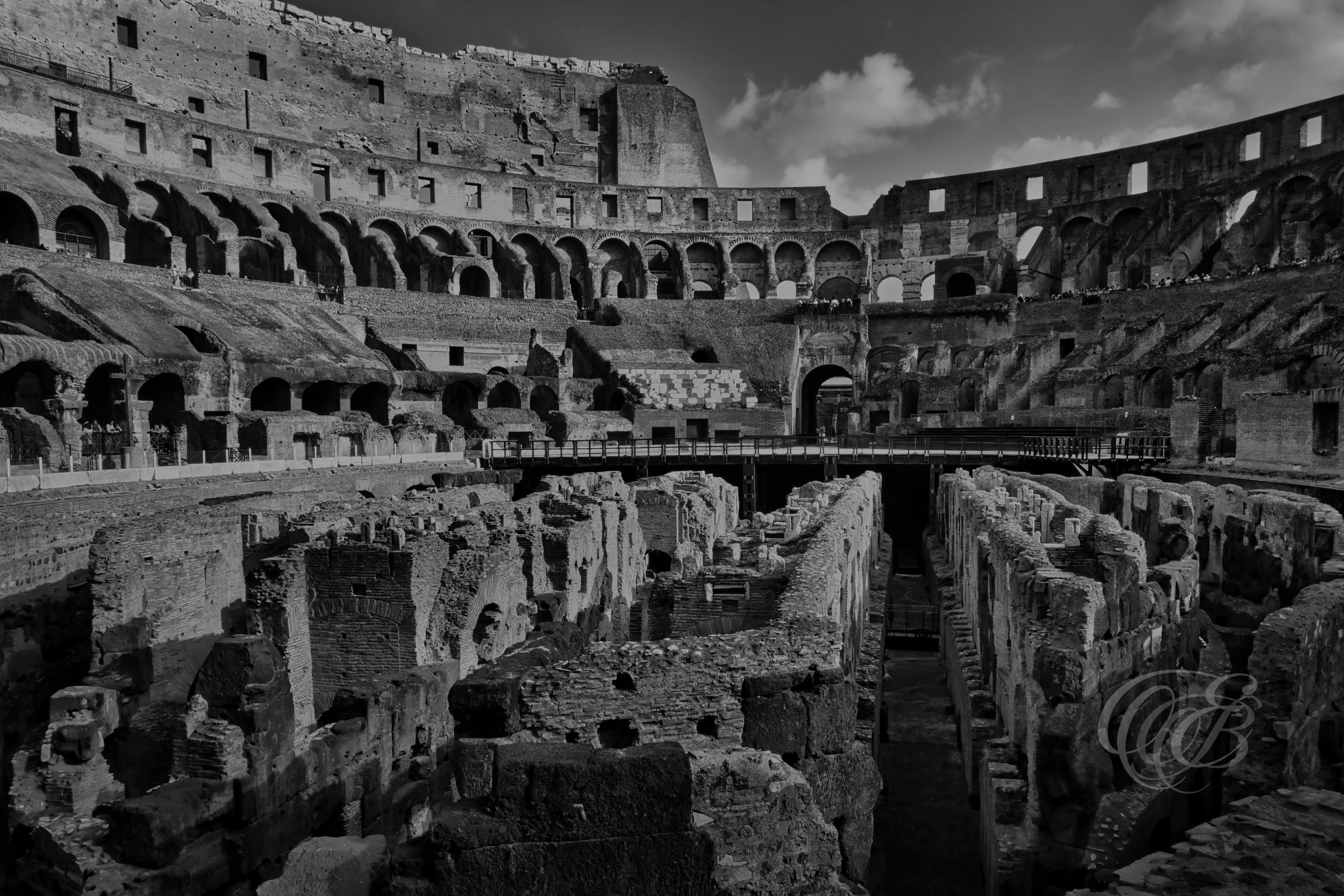 Rome, Italy — The Colosseum at Sunset — Eduardo Bartoli Photography — Black and white photograph of the Colosseum at sunset, showcasing the ancient Roman amphitheater, historic arches, and architectural details illuminated by evening light in Rome, Italy — Eduardo Bartoli Photography.