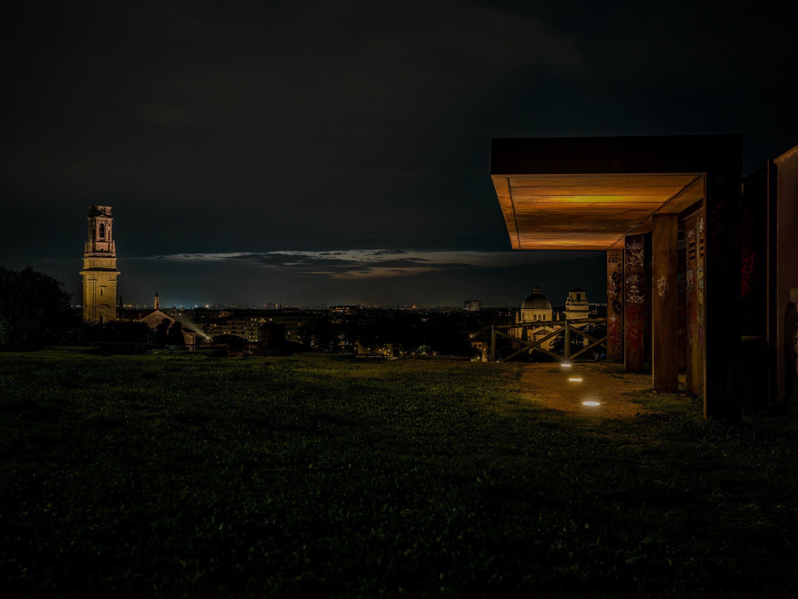 A cinematic night panorama of Verona from Castel San Pietro. Minimalist architectural fine art designed for refined interiors and collectors.