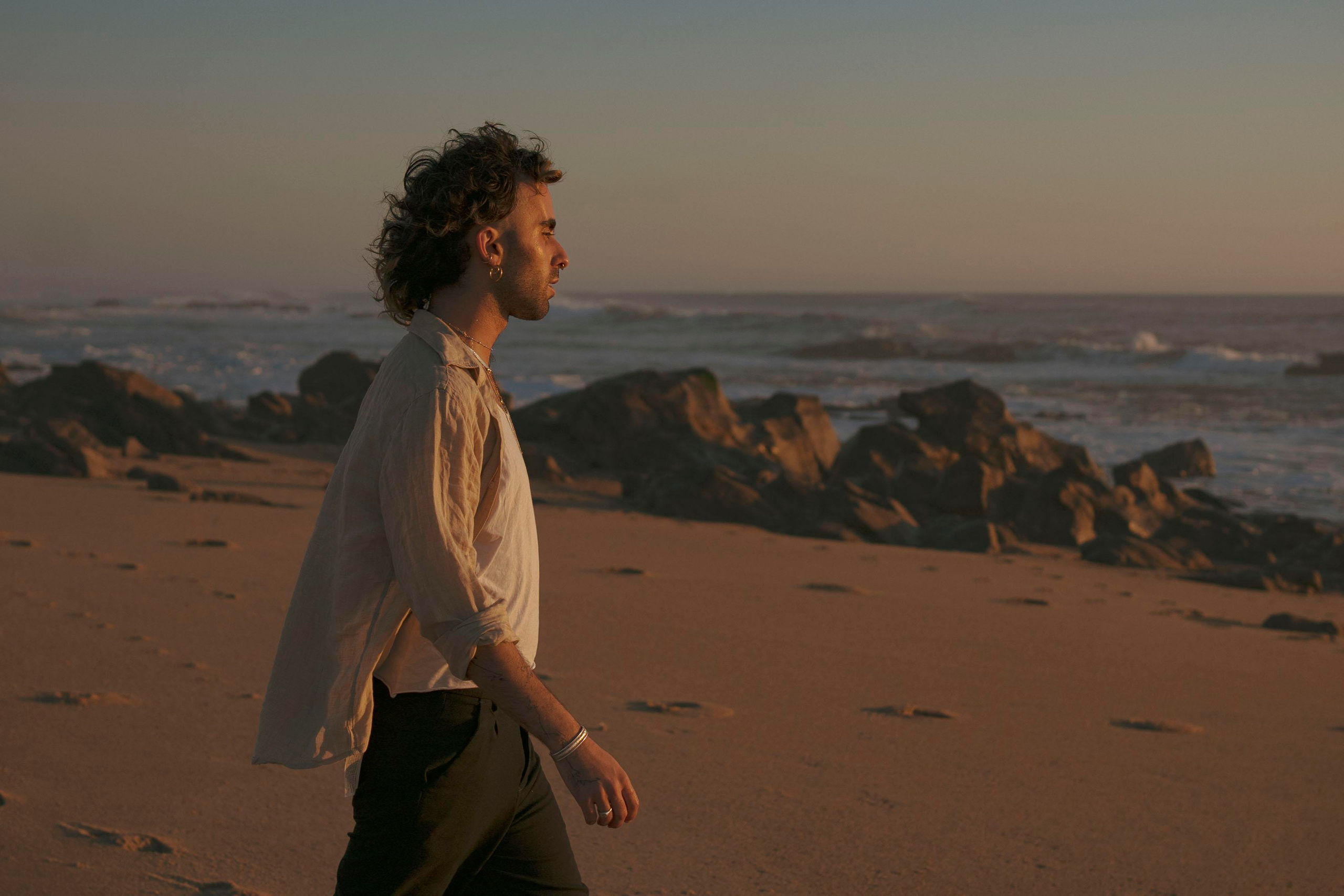 Silhouette of a person with a sunset sky in the background.