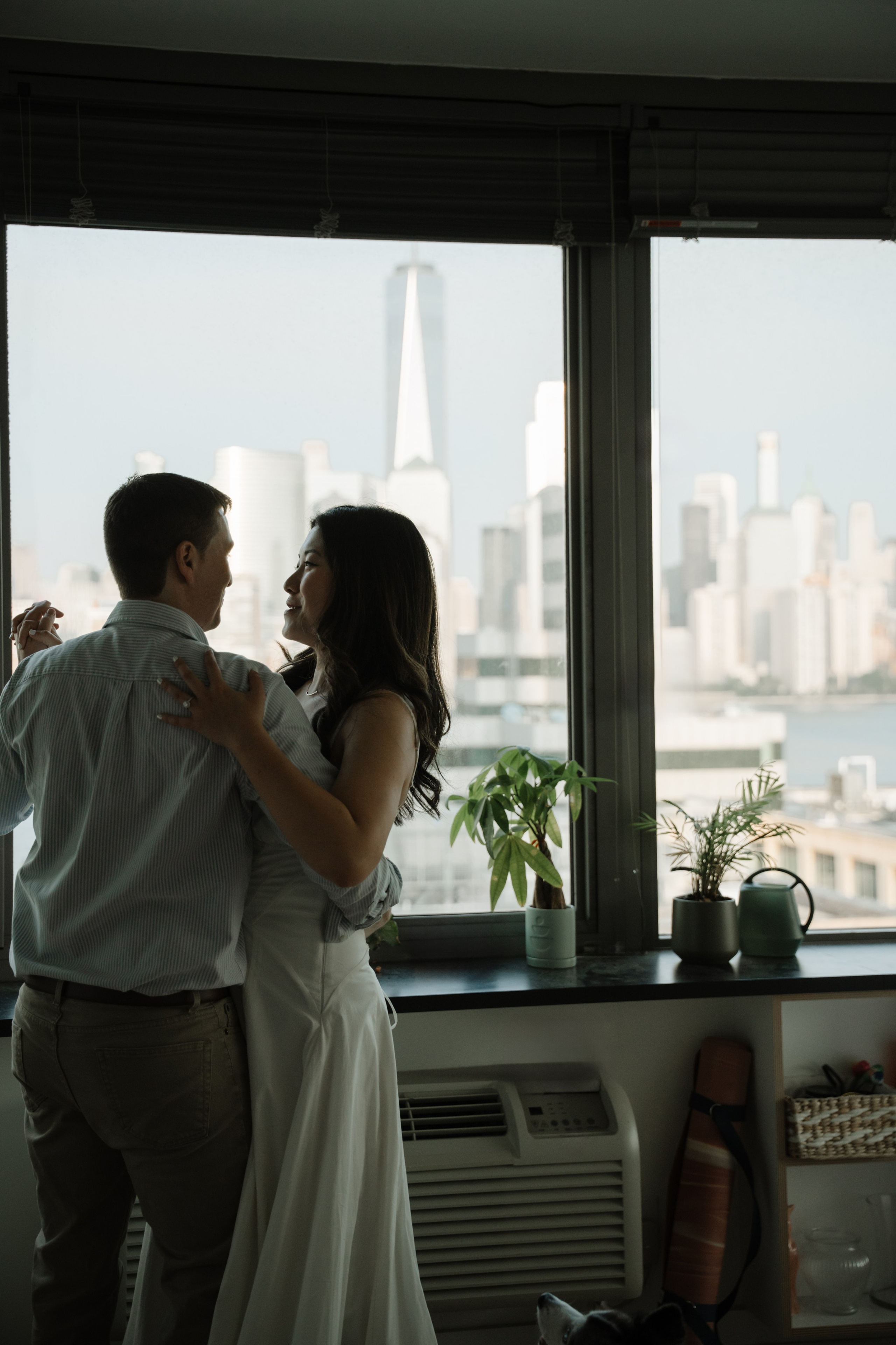 An adorable couple with their dog. Portrait and wedding photographer in New York
