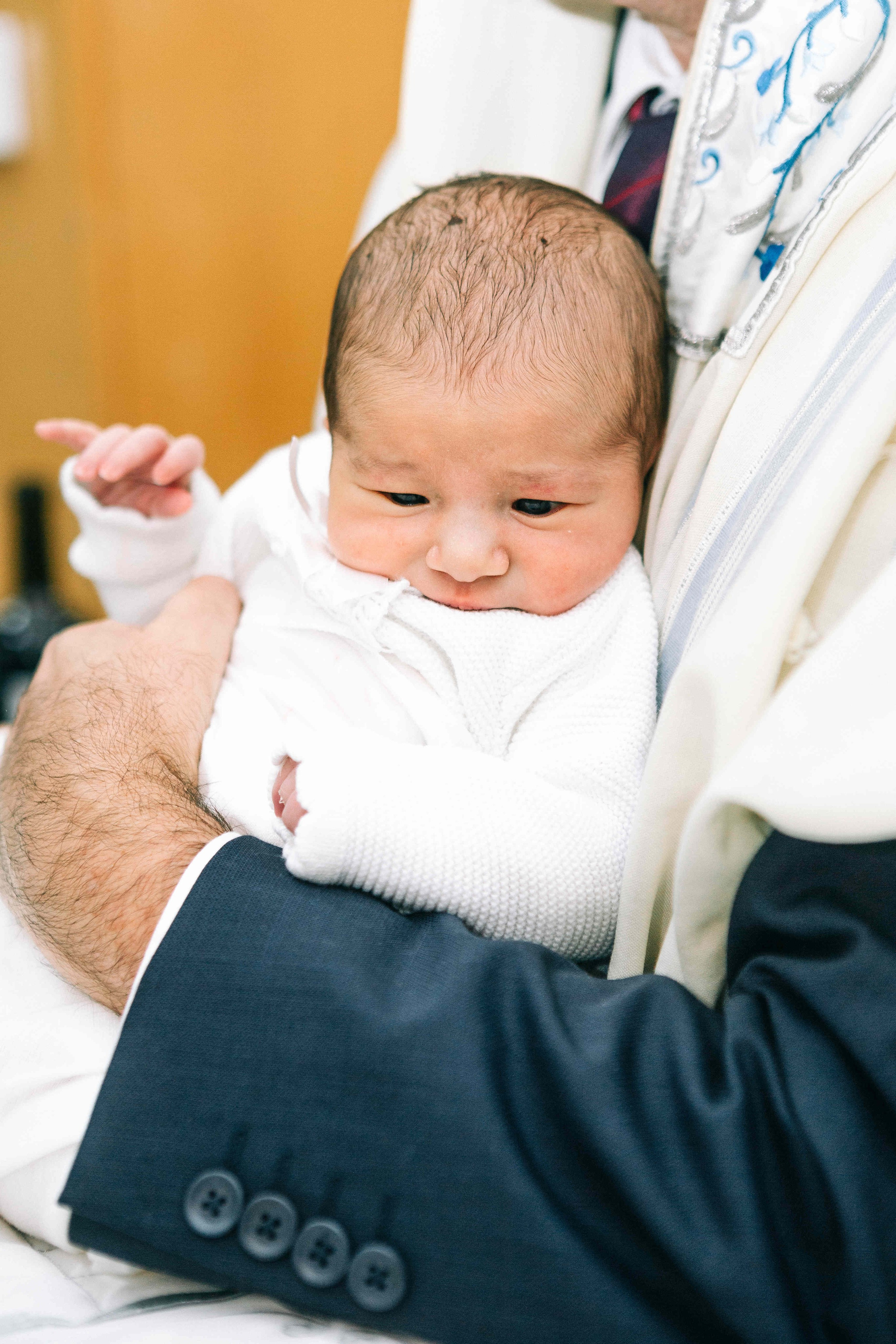 BRITH MILA IN THE SMALL SYNAGOGUE. PHOTOGRAPHER IN ISRAEL