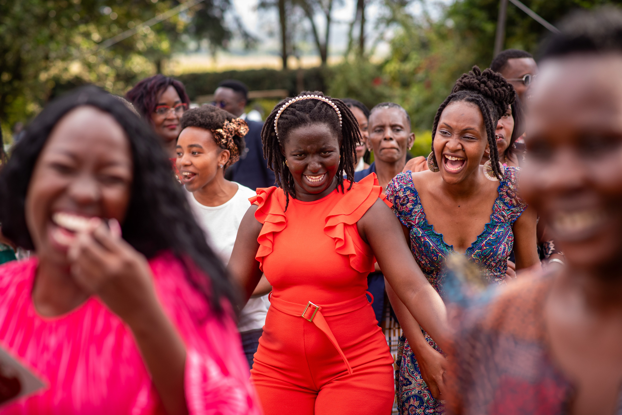 Happy wedding guests dancing at a wedding reception in Nairobi
