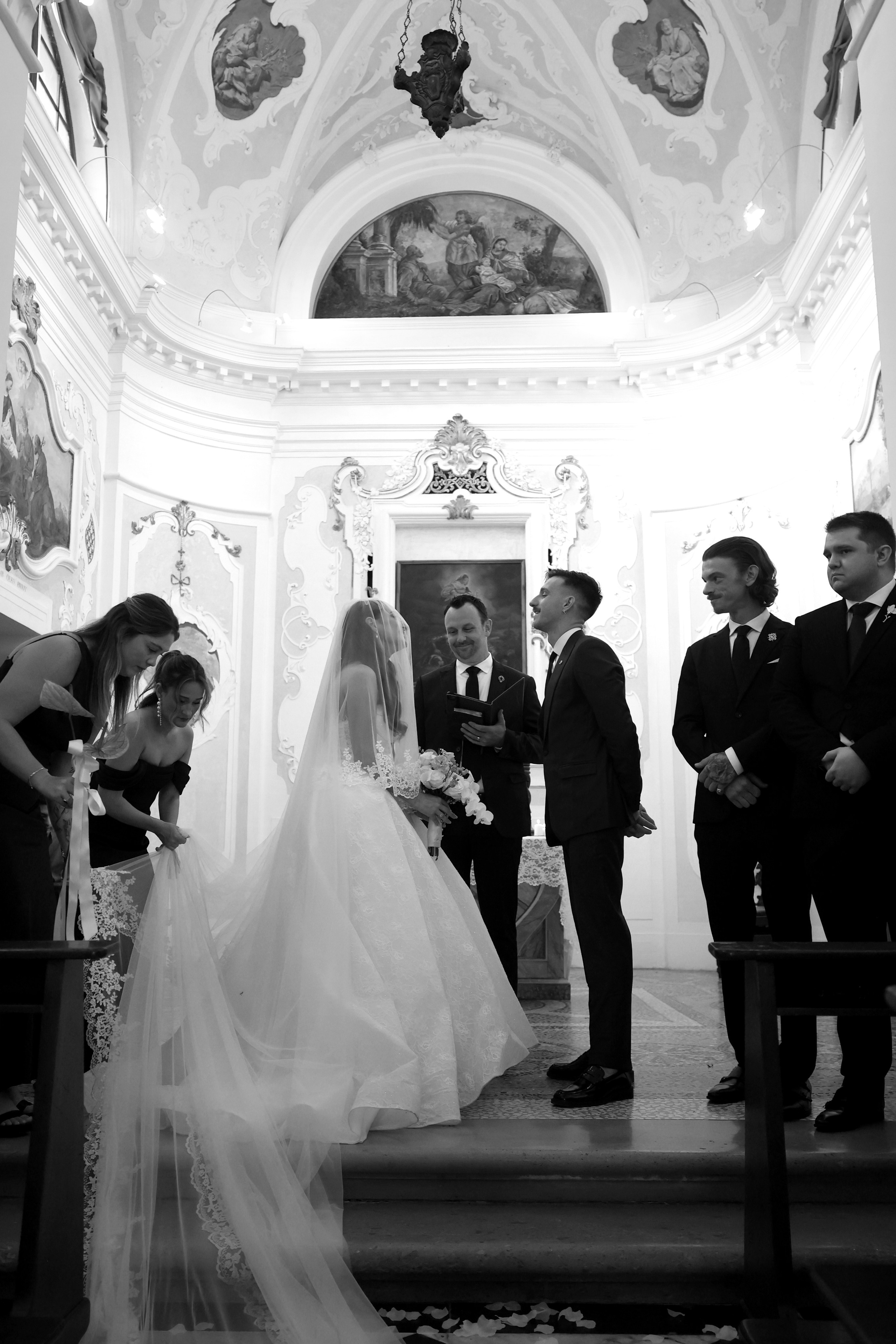 Romantic wedding ceremony inside a historic Italian church.