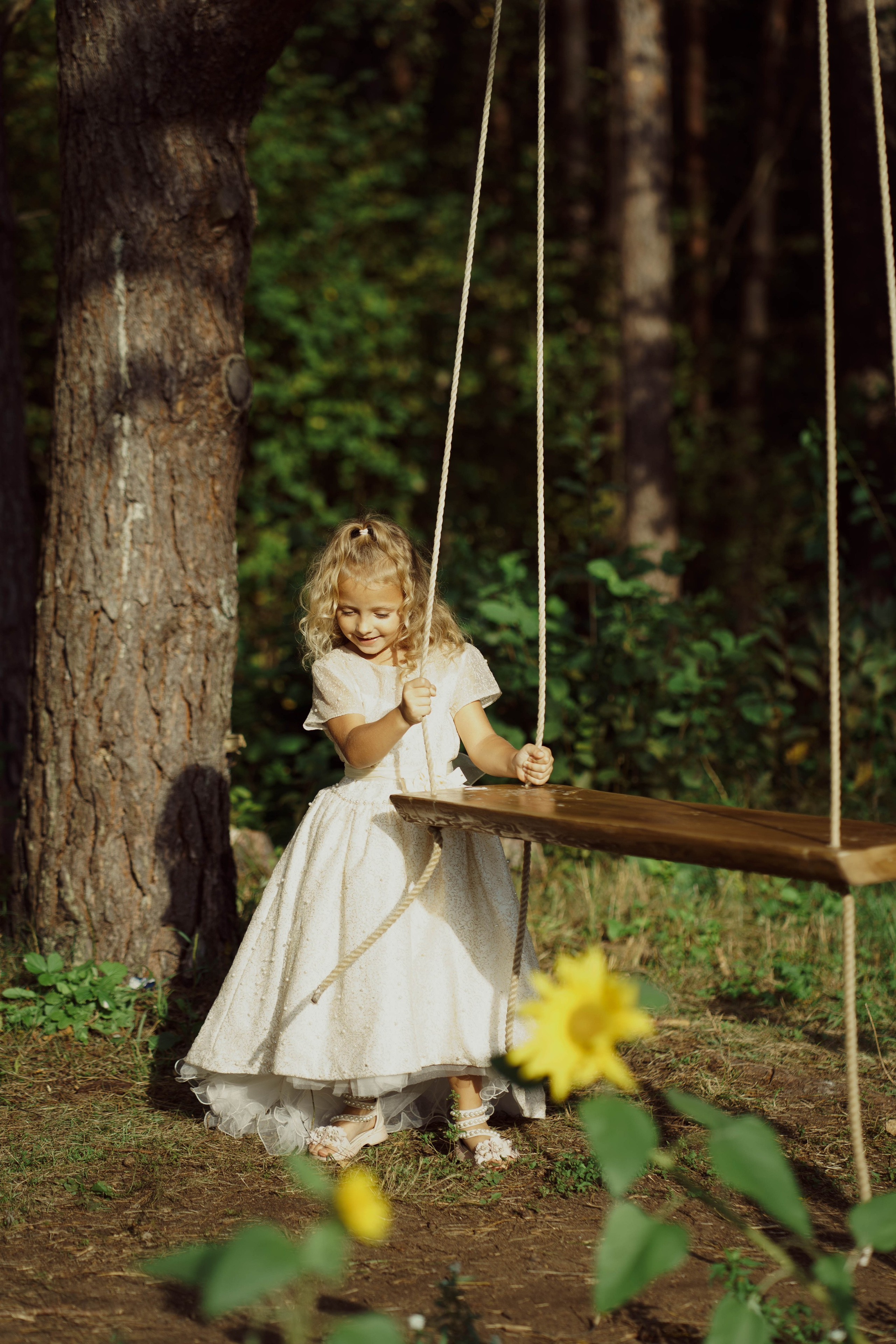 Mama ir dukra — saulėgražose. Fotografija — Olga Bojarin