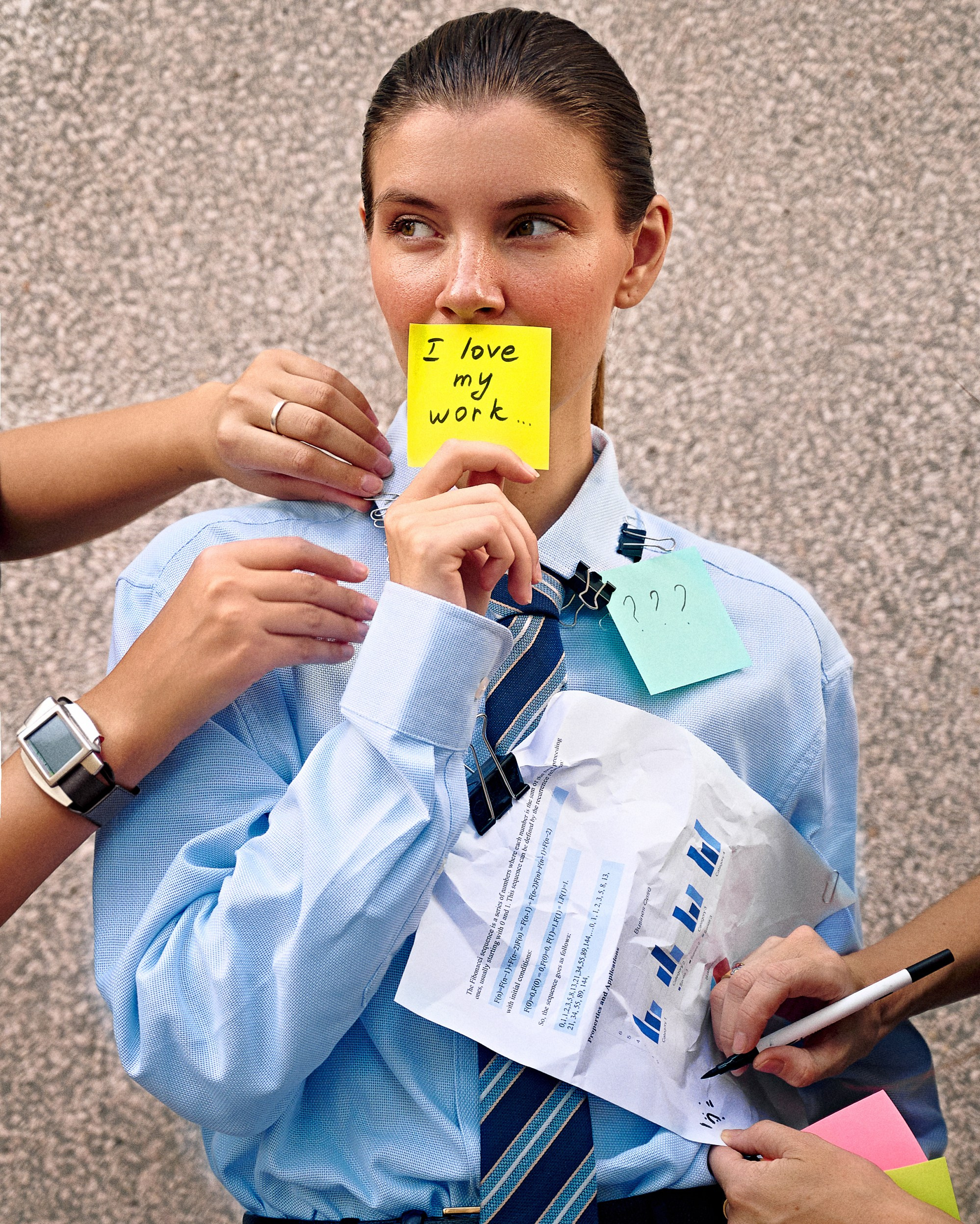 Close-up portrait of model holding phone, soft natural lighting