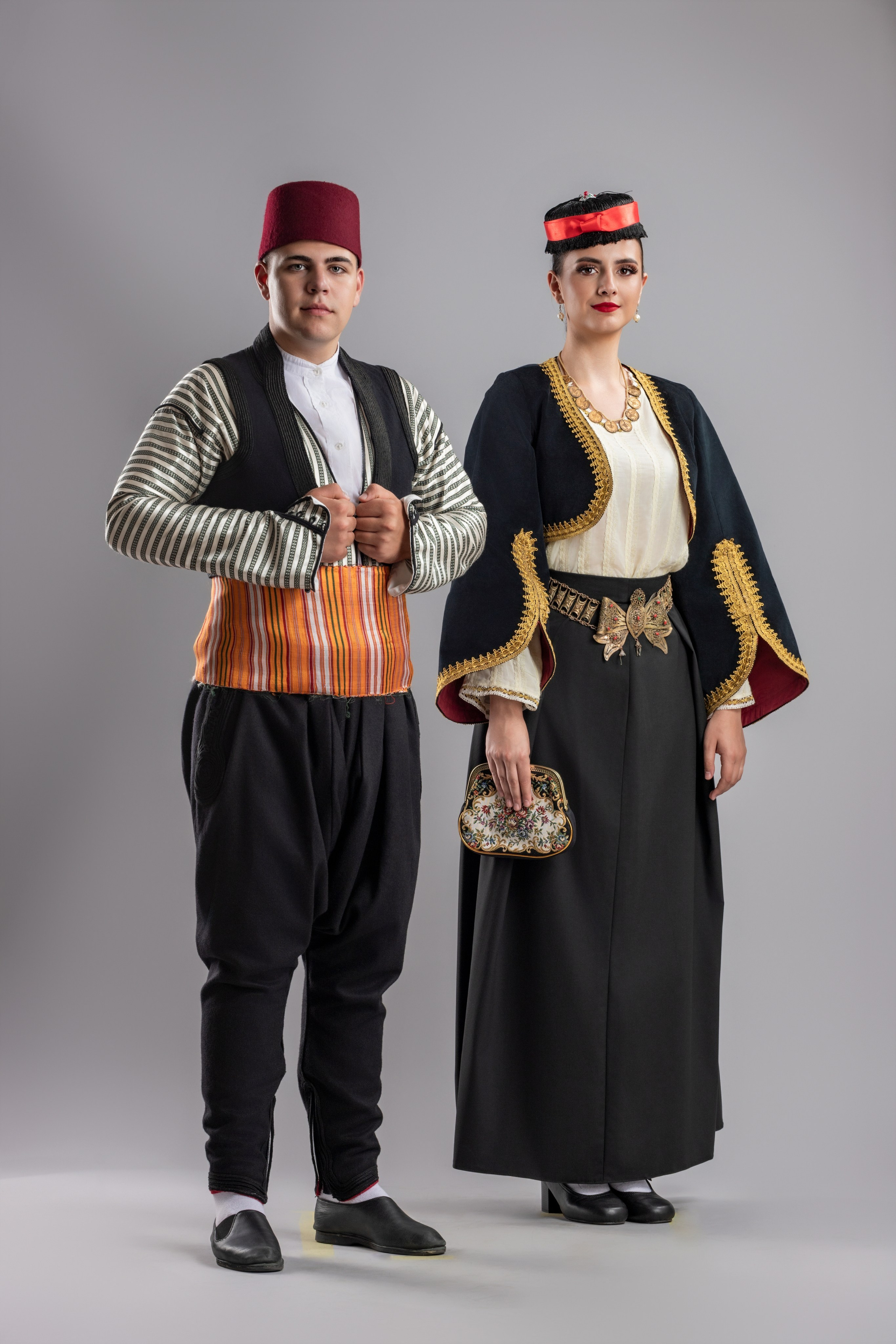Studio portrait photography of traditional folk costumes from Bosnia and Herzegovina featuring authentic cultural clothing, embroidery, jewelry and handcrafted garments, photographed by Namir Čomaga. The images highlight the richness, craftsmanship and cultural heritage of Bosnian traditional costumes through carefully lit studio portraits.
