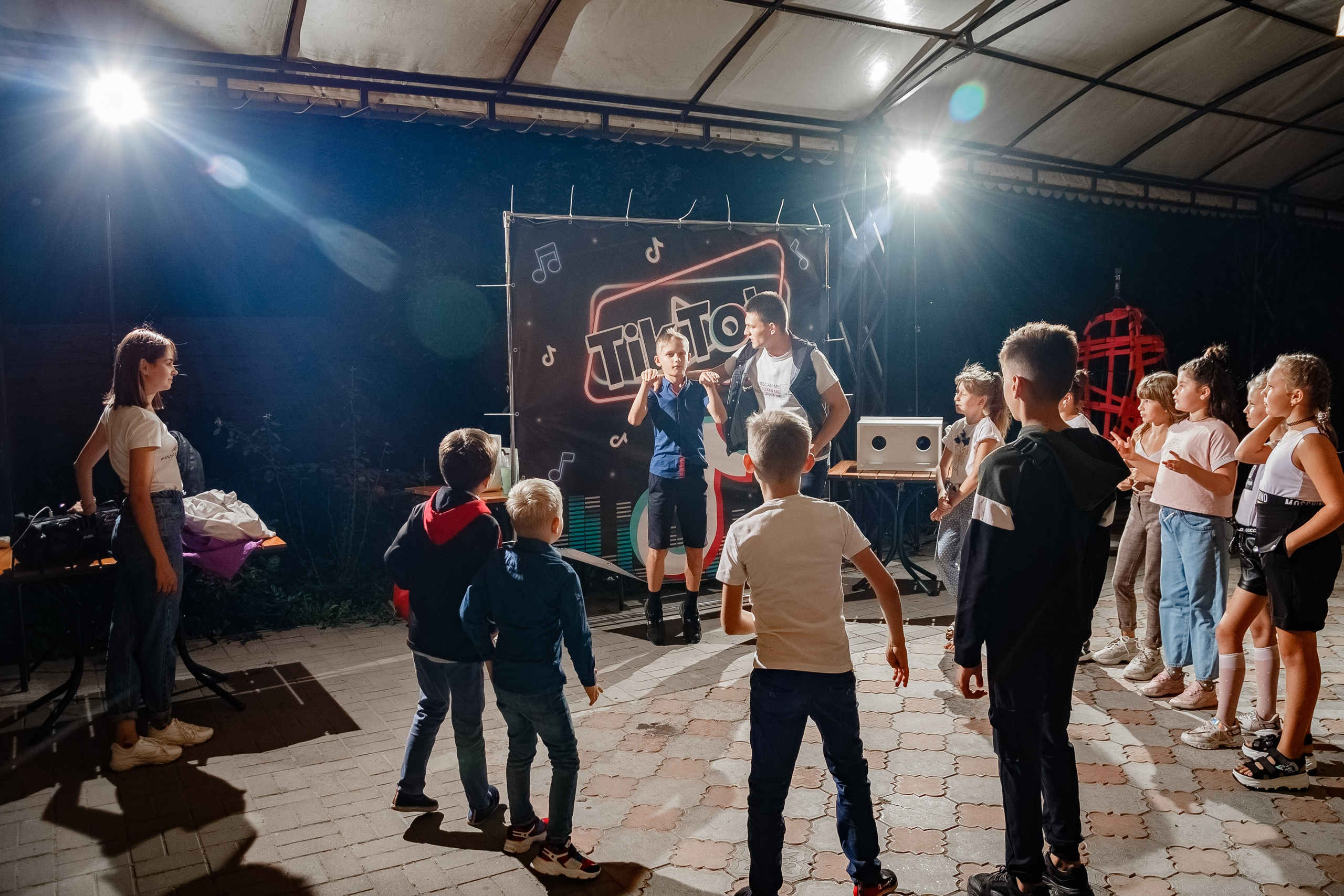 Night reportage shooting of the event with external light sources. Retoucher, color corrector, and photographer, I work remotely all over the world