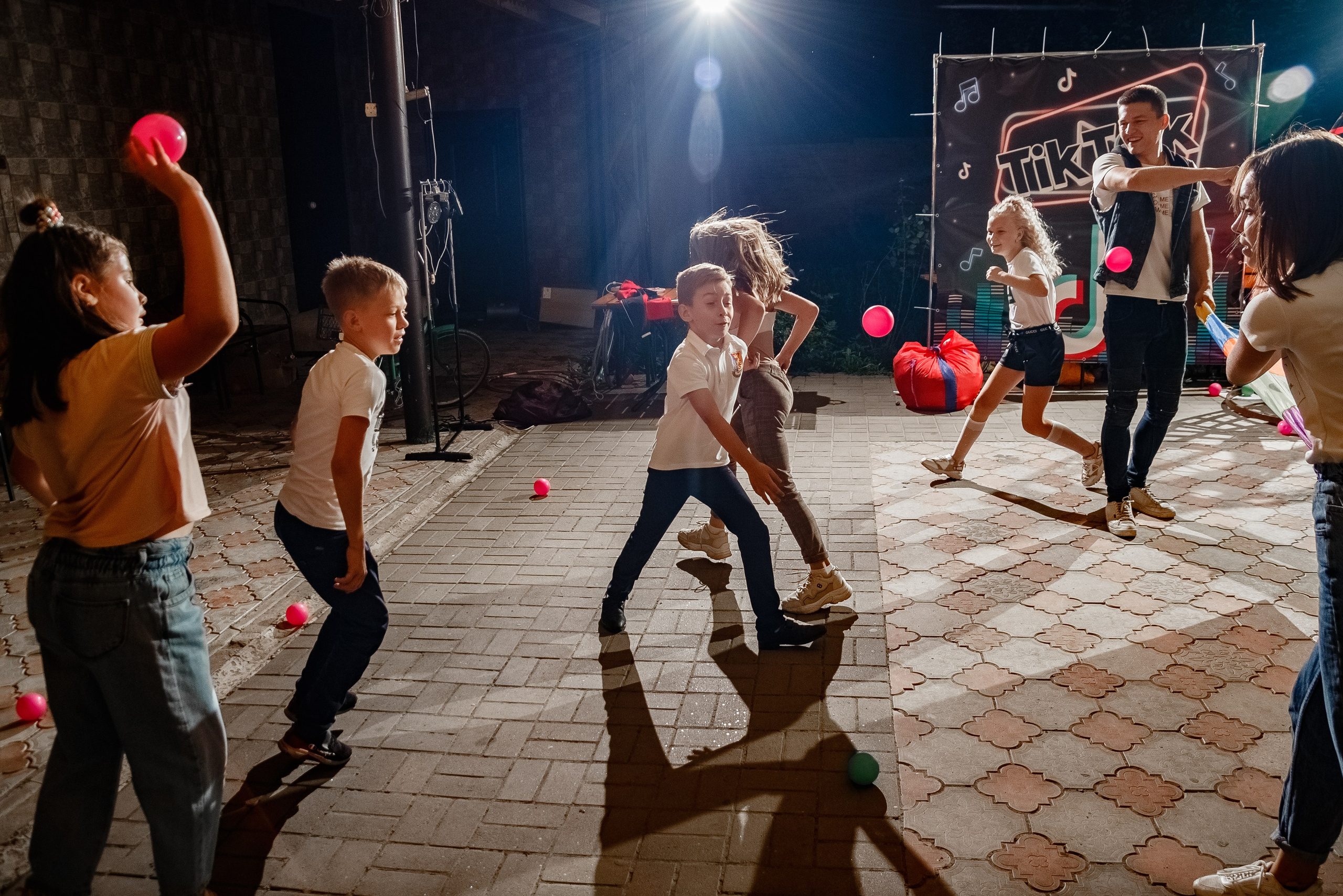 Night reportage shooting of the event with external light sources. Retoucher, color corrector, and photographer, I work remotely all over the world