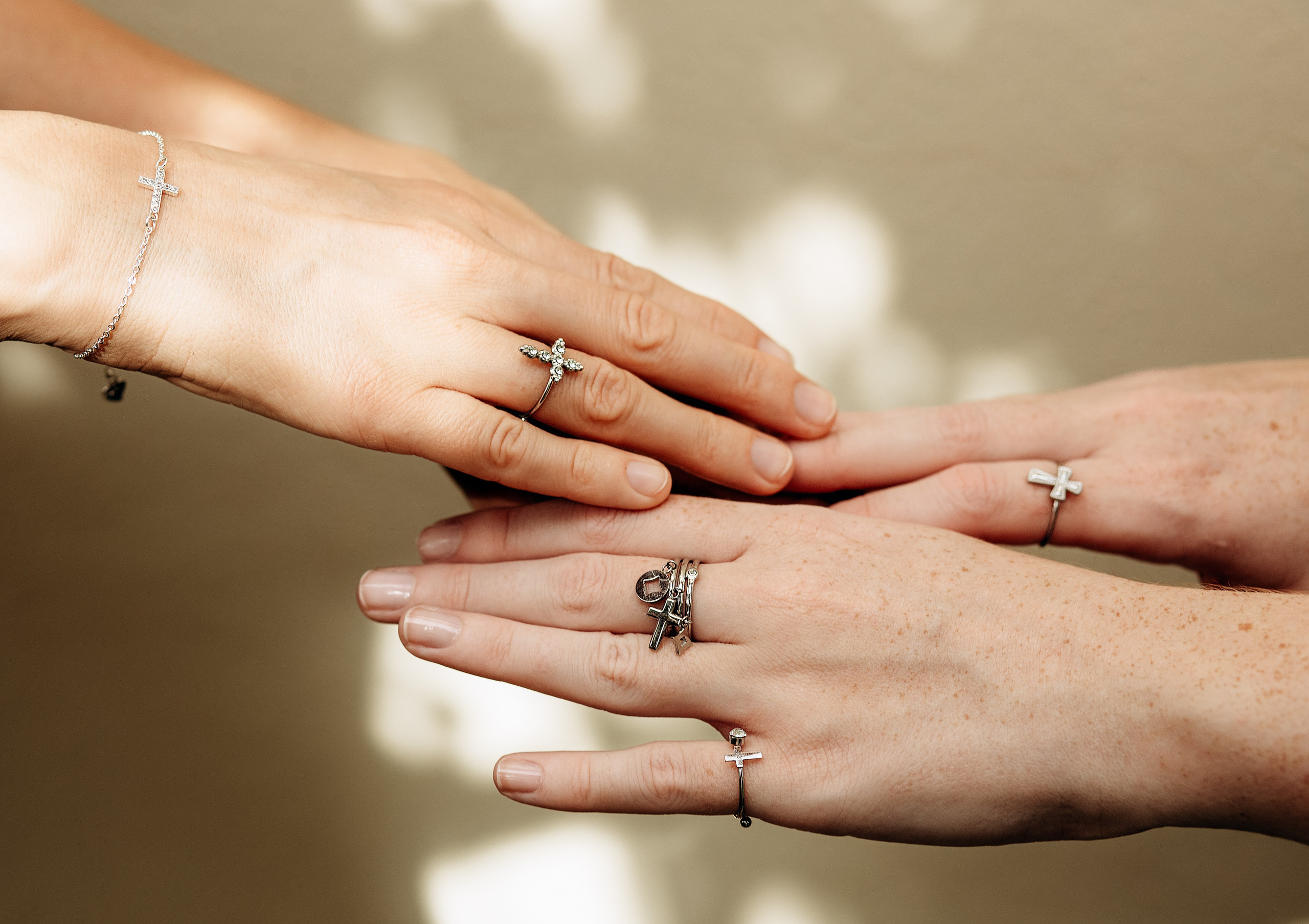 Close-up brand photoshoot of minimalist silver rings with cross designs, taken in Valencia, Spain—perfect for showcasing handmade jewelry and product photography for brands looking to elevate their content in Valencia and across Spain.