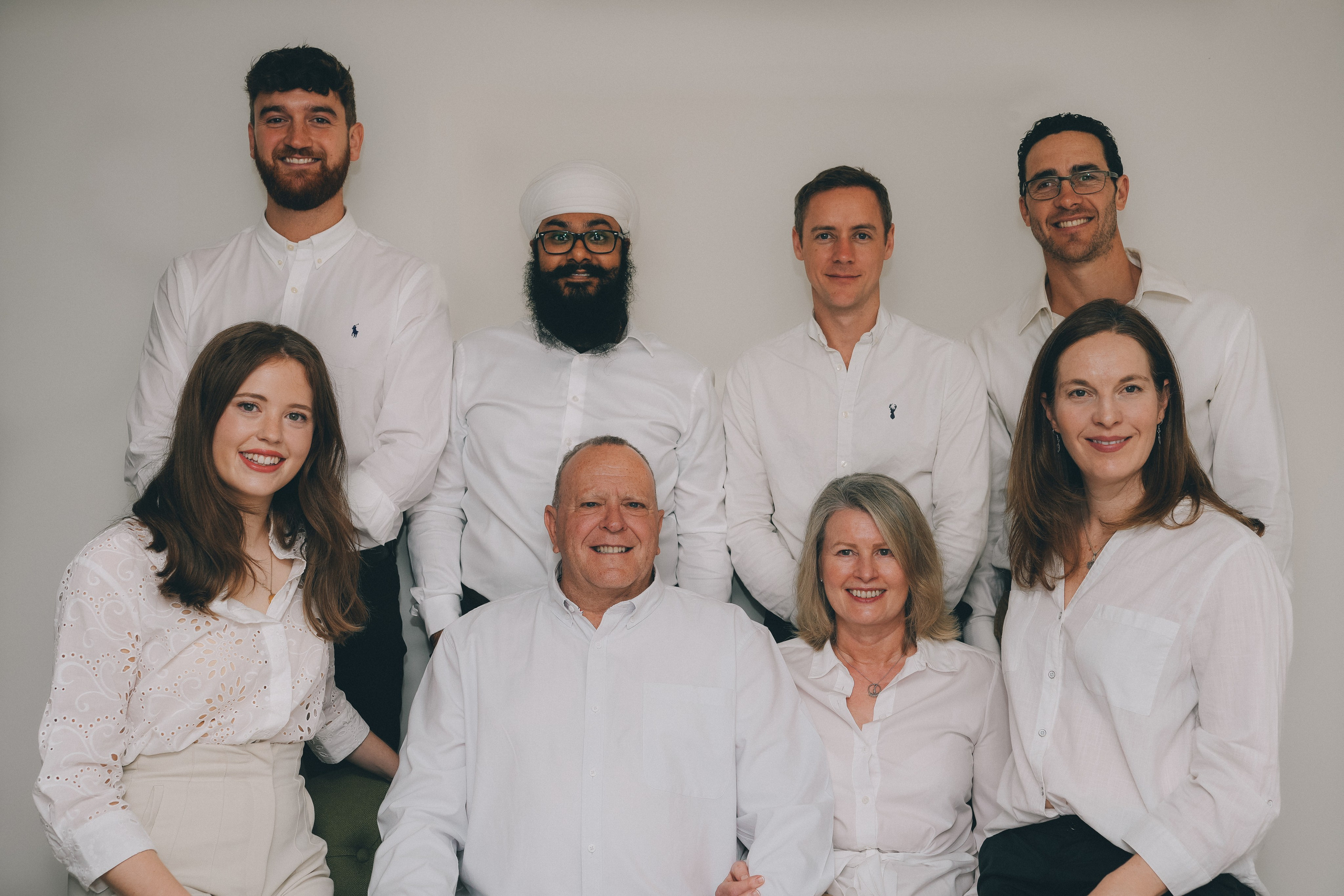 Brand photography of a professional team in a clean, modern studio setting