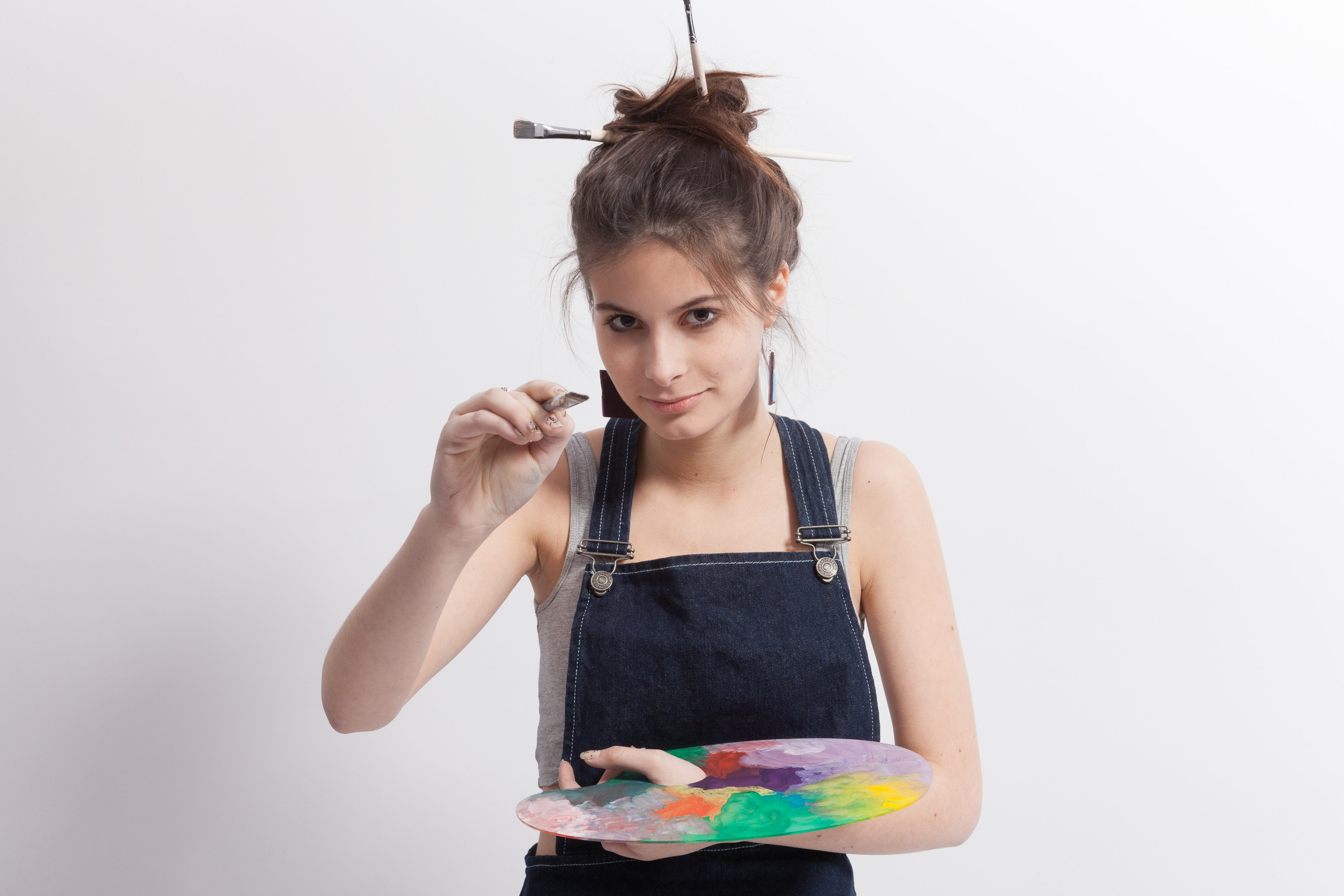 Portrait of a young artist girl on white studio background - photographer Andrey Dunin