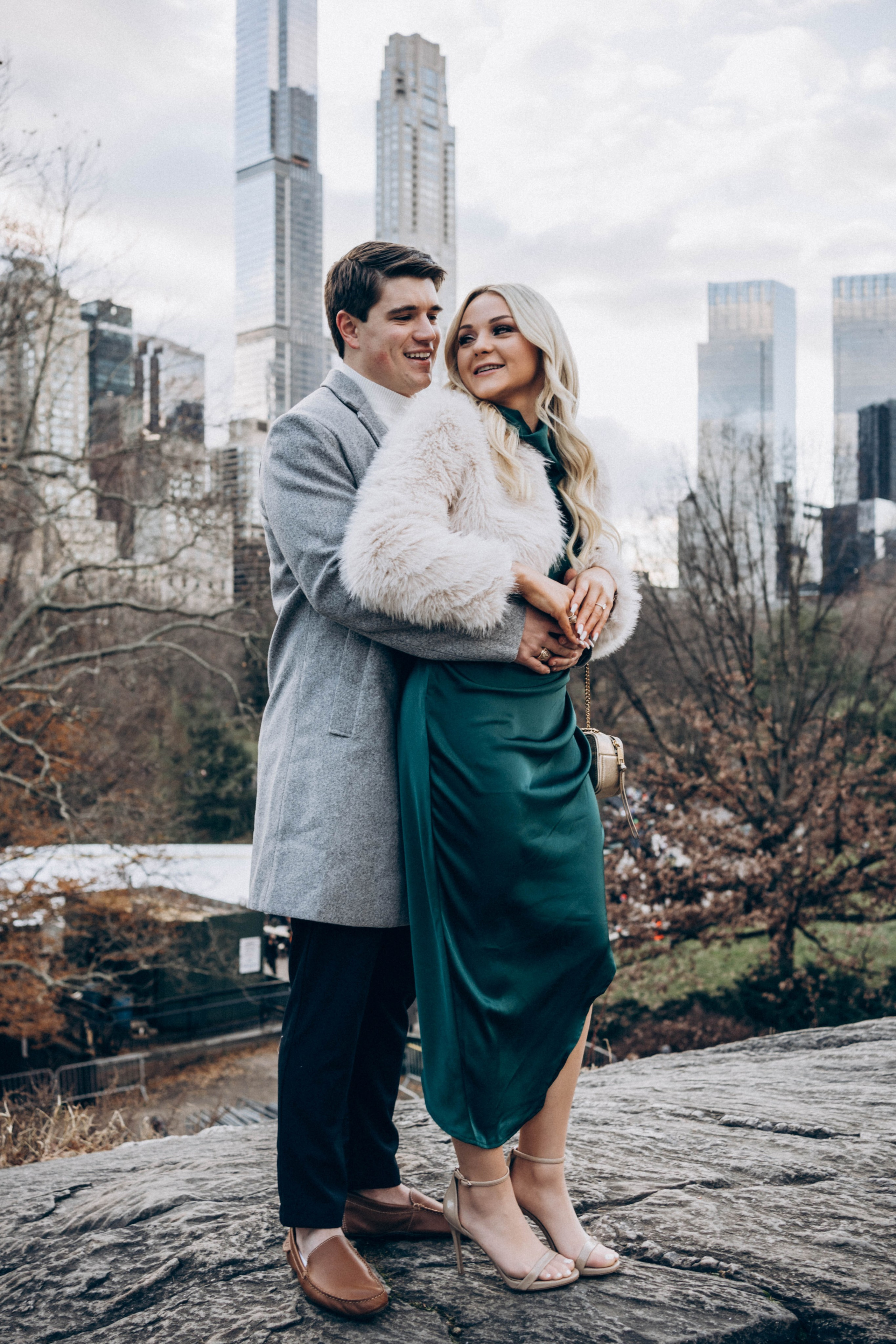 Proposal at Brooklyn Bridge Park with city lights.