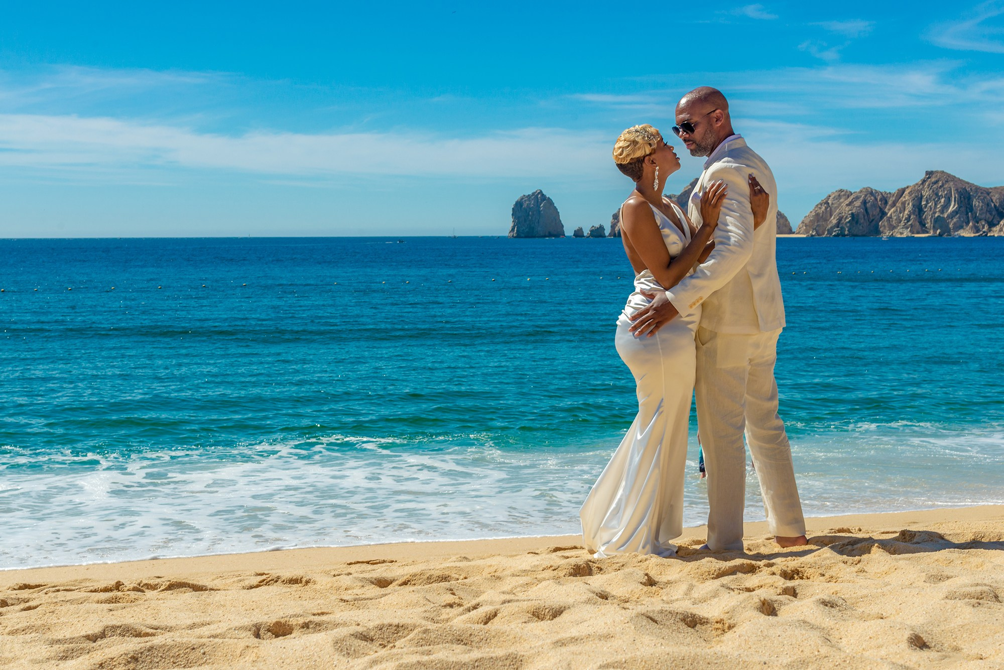 Beach wedding in Cabo San Lucas – bride and groom portrait by the sea, luxury destination wedding photographer