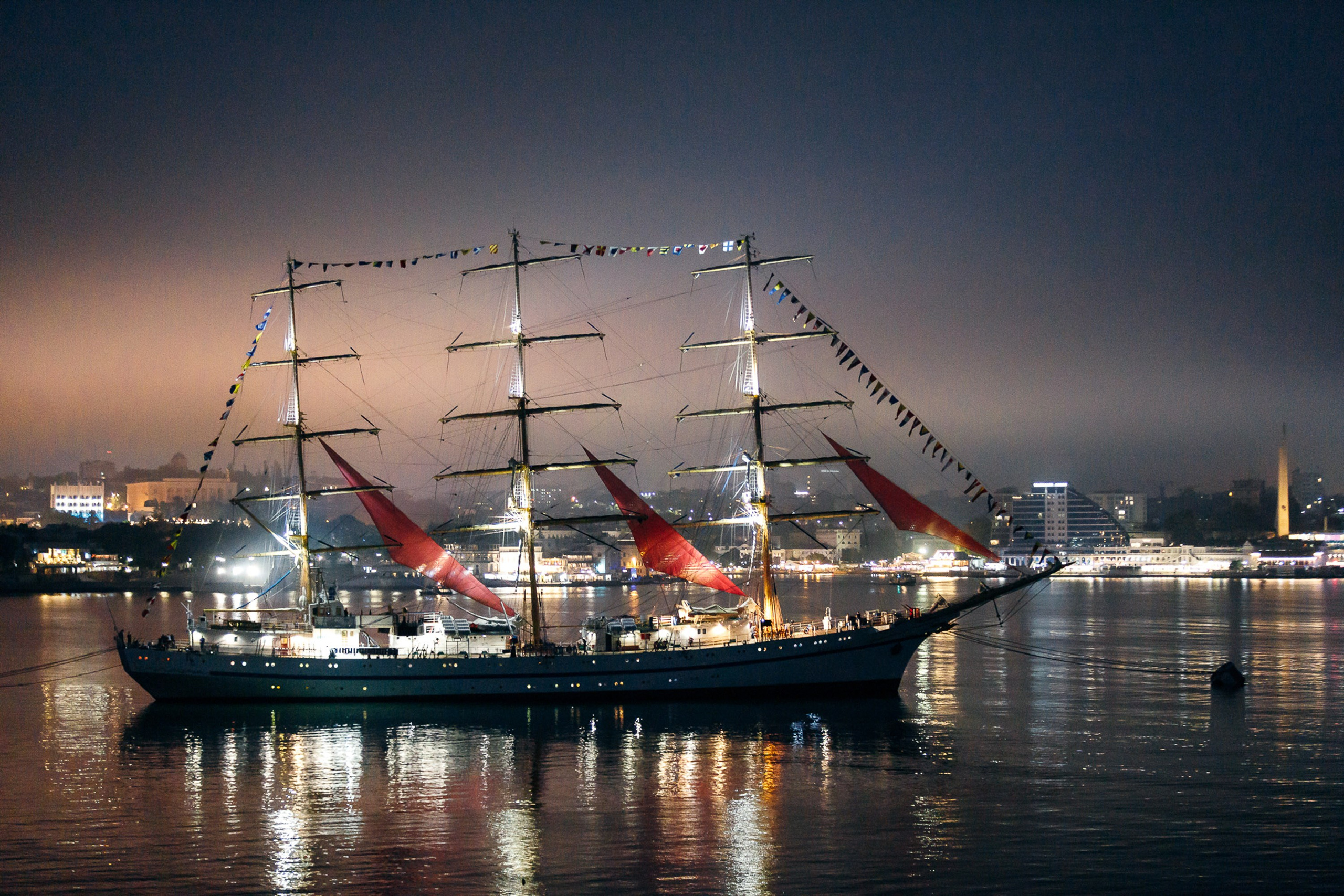 Harbor view with ships at sunset, scenic background