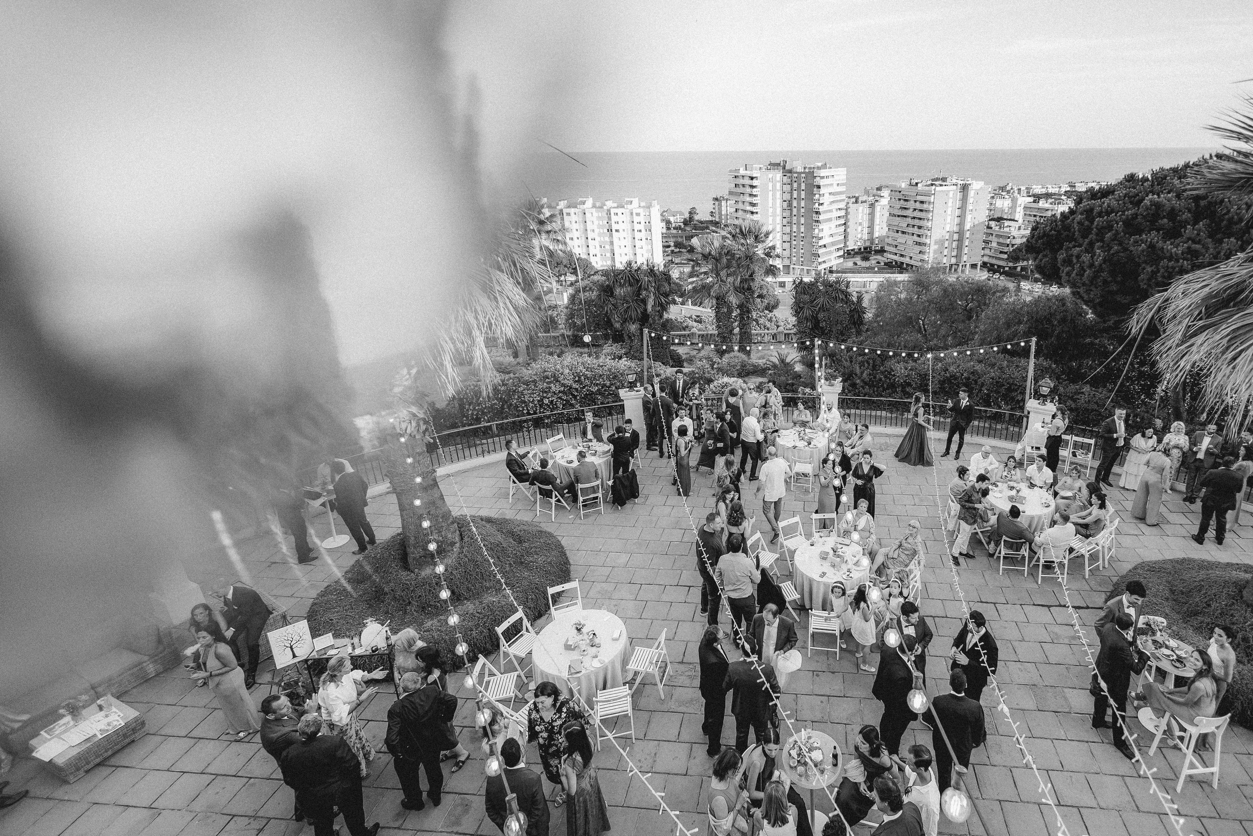 Guests are enjoying the cocktail hour with a view of the Mediterranean sea 