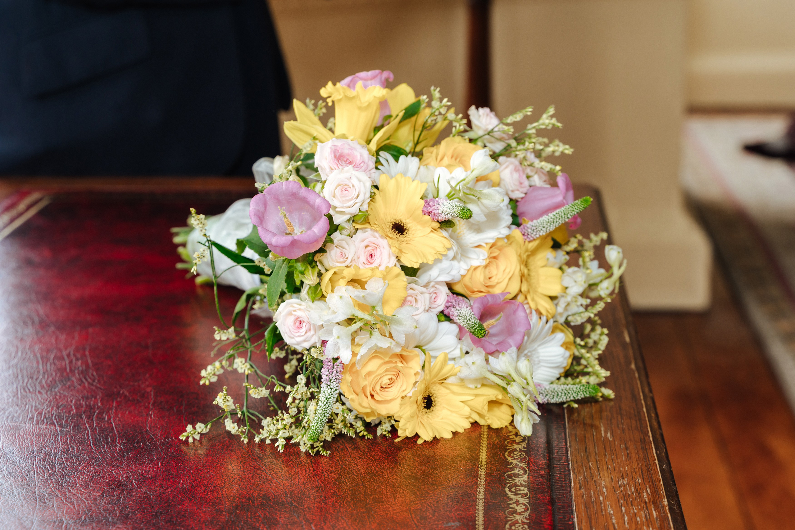 Bridal bouquet of white flowers on the wedding day of Luke and Nicola at Danson House