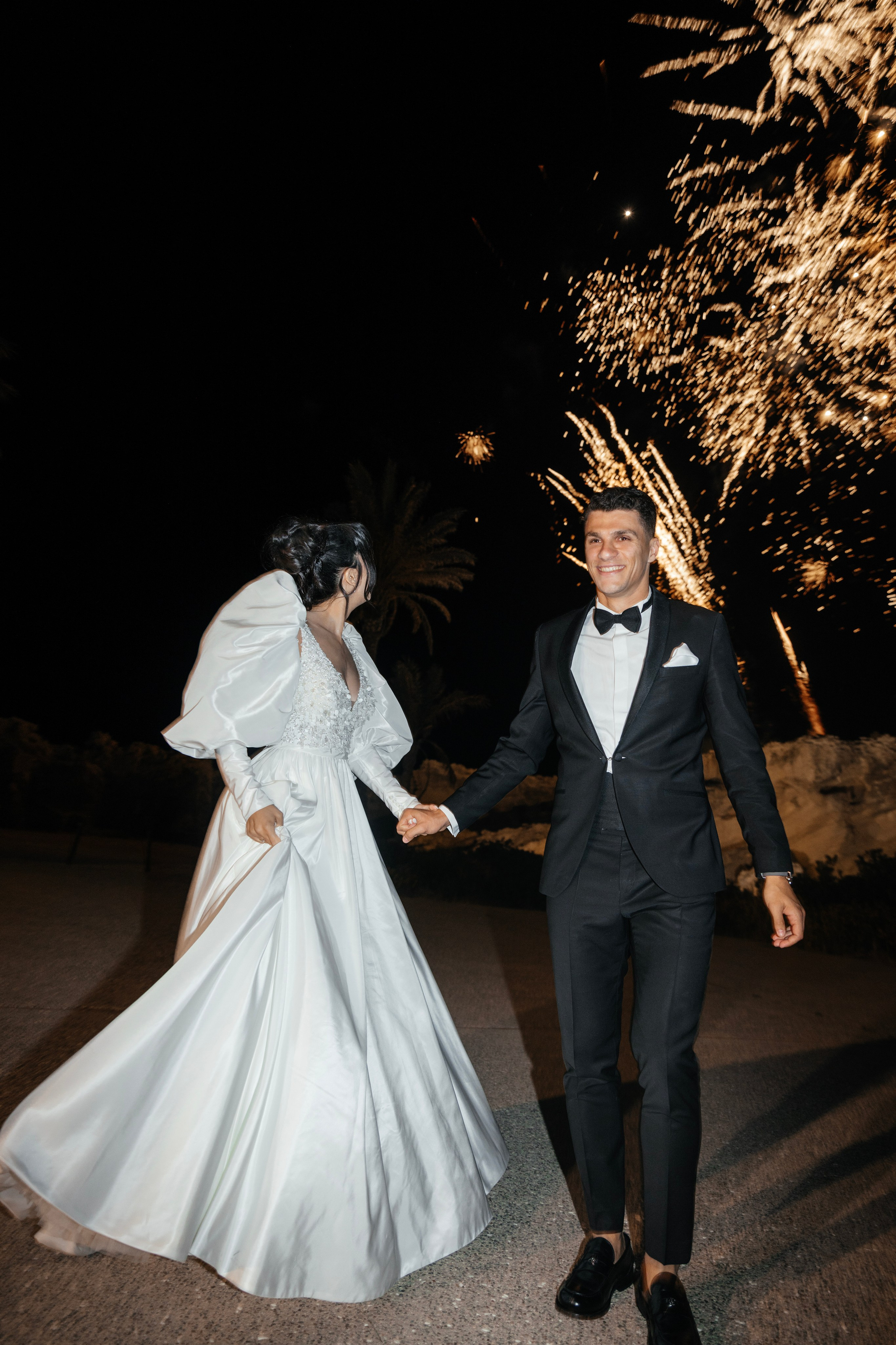 Bride and groom are watching the firework. Rhodes Greece