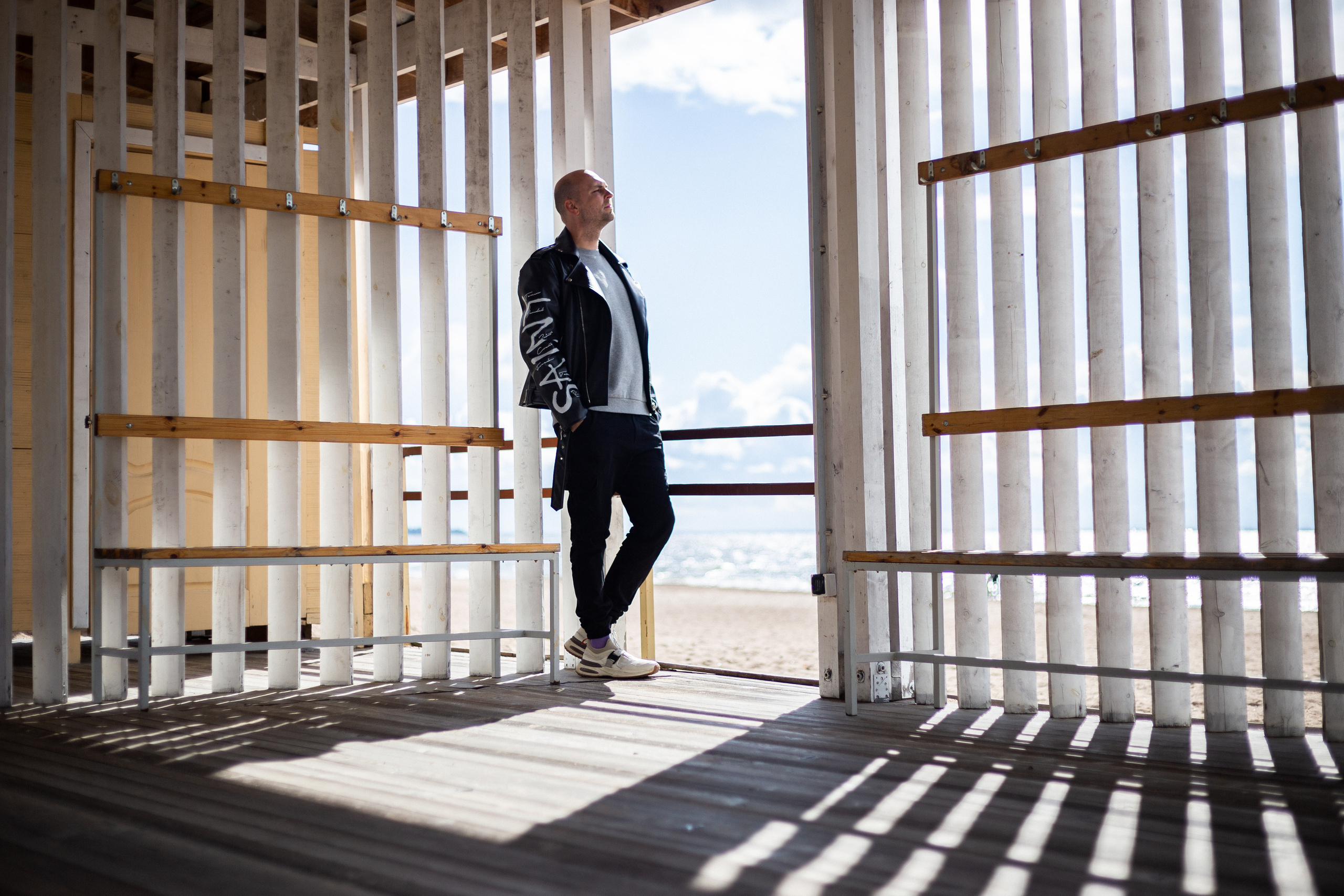 a photograph of a man standing in a doorway