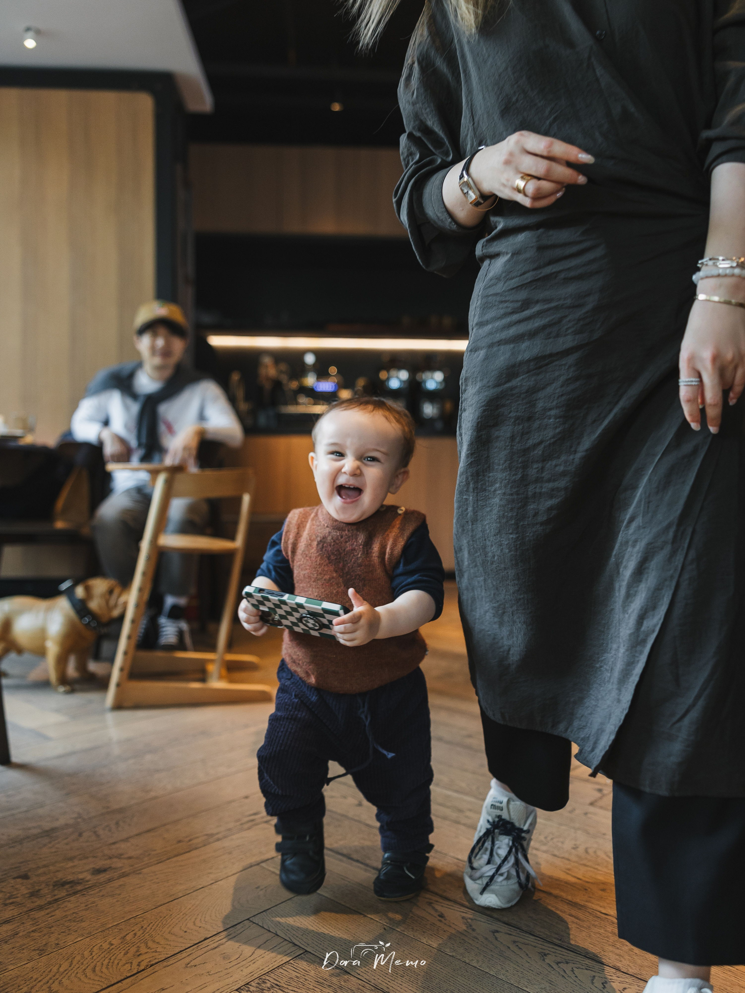 The one-year-old baby playing with his mom.